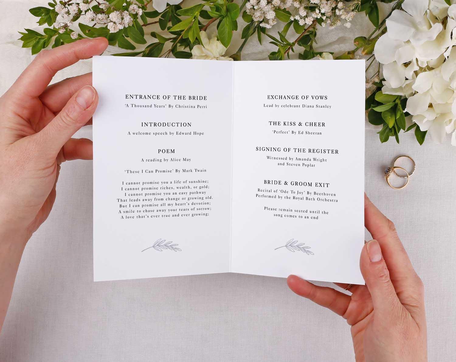 Minimalist Order Of Service booklet opened, displaying wedding ceremony details and elegant design.