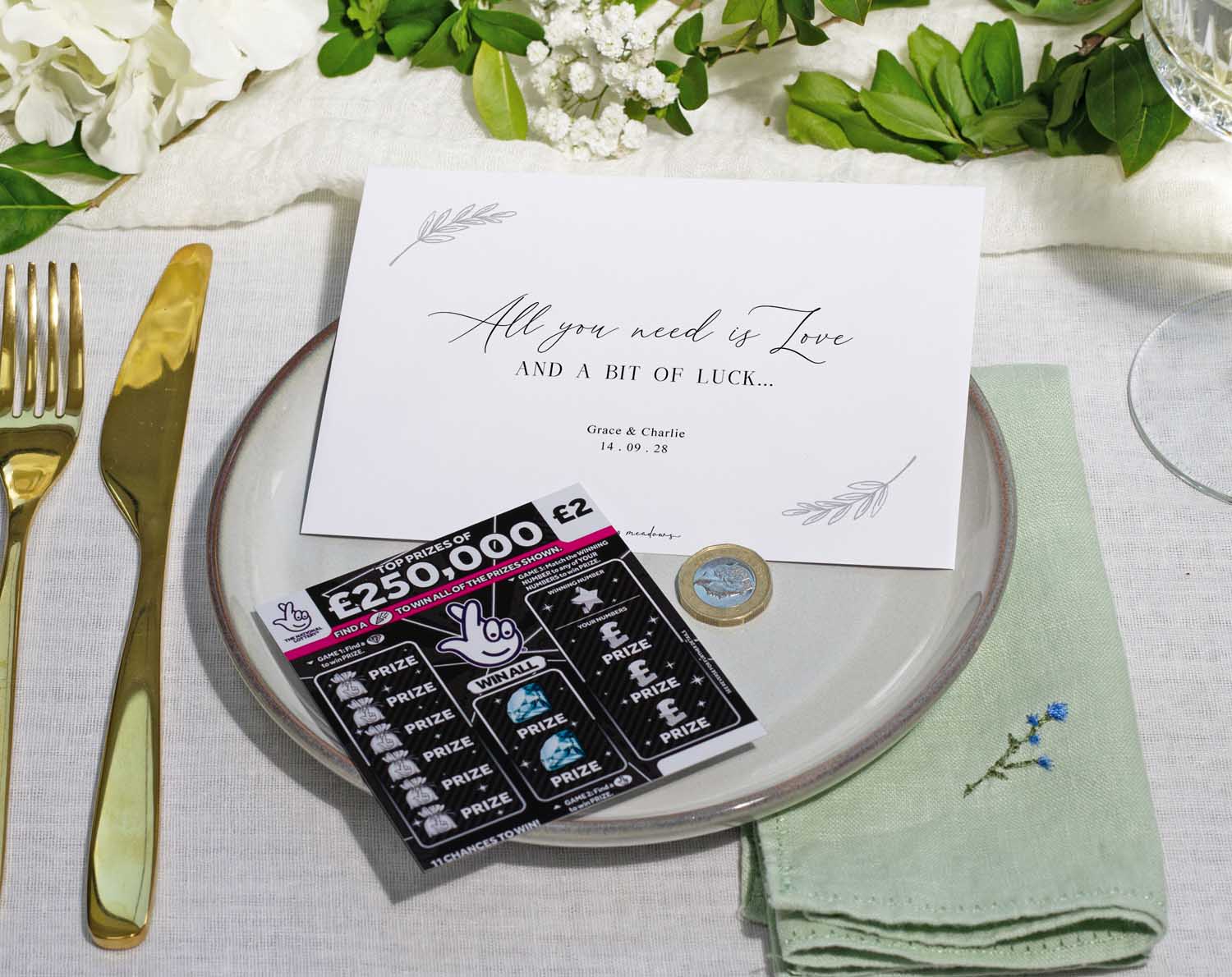 Minimalist Scratch Card Envelopes displayed on a wedding table setting, featuring a scratch card and elegant place card.