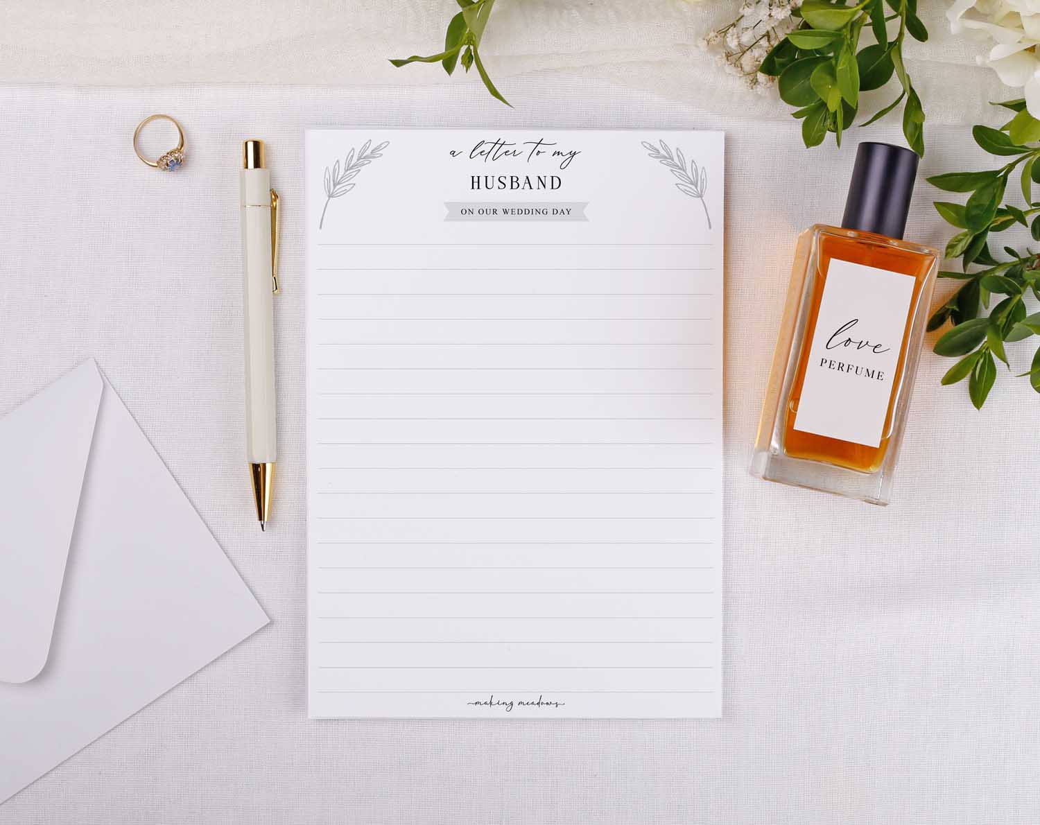 Minimalist Wedding Letter to My Husband with a pen, envelope, and perfume on a decorative background.