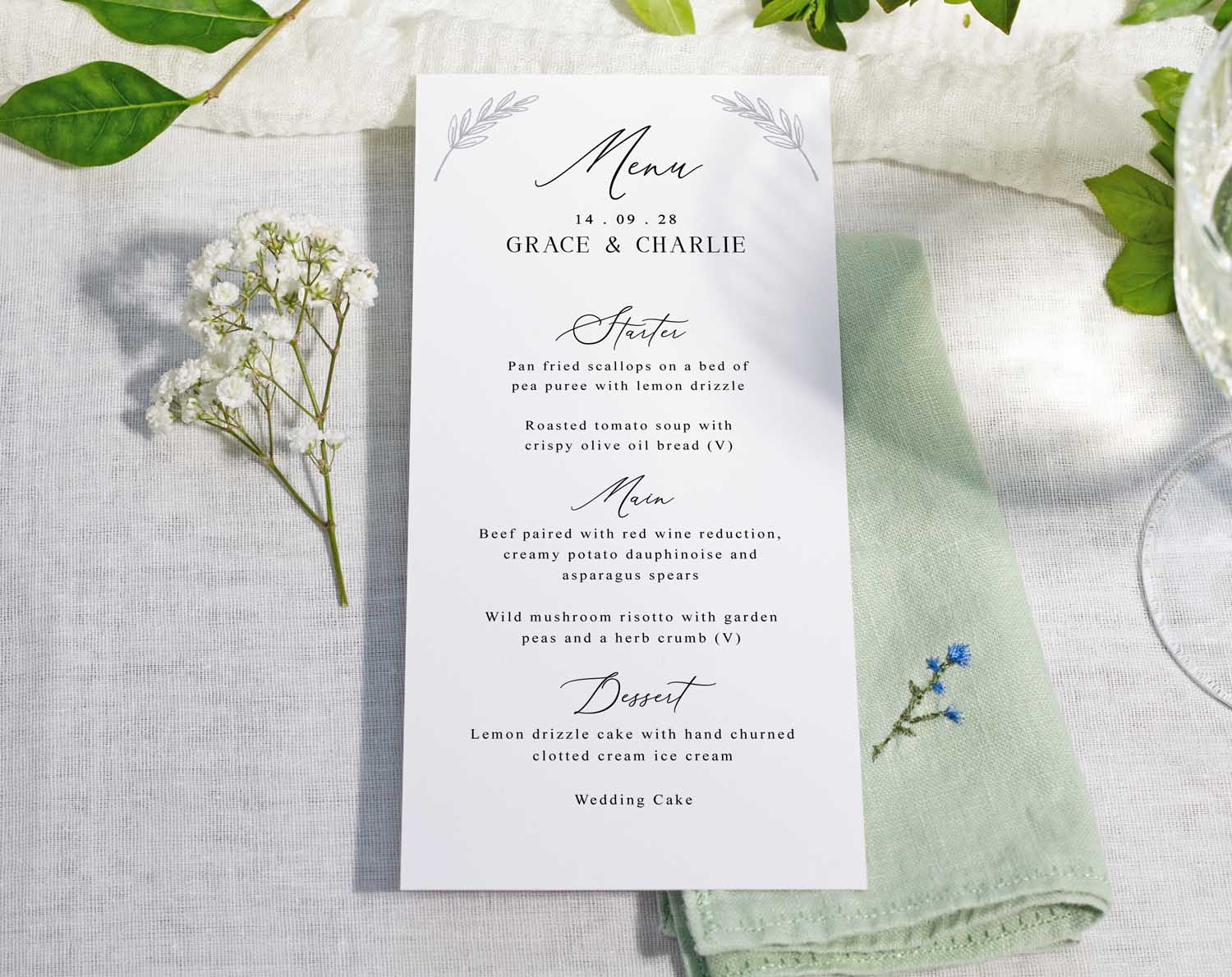 Minimalist Wedding Menus displayed on a table, featuring stylish layout for guests' meal options.