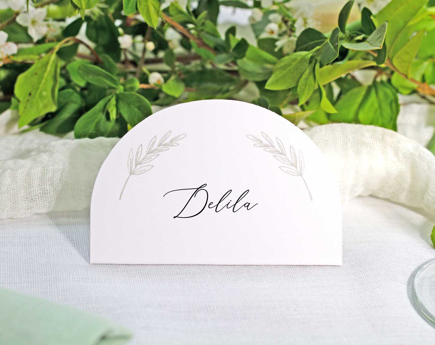 Minimalist Wedding Place Cards featuring elegant leaf design and custom name for a sophisticated table setting.