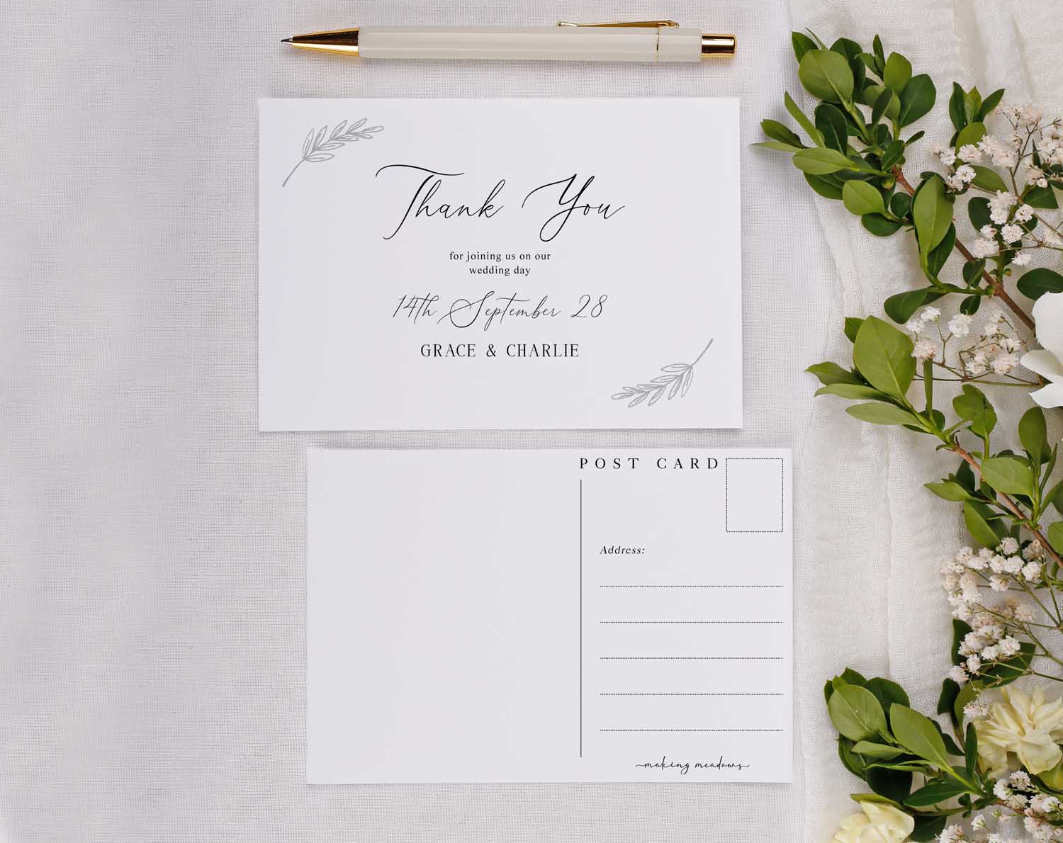 Minimalist Wedding Thank You Postcards featuring elegant design and floral accents on a soft backdrop.