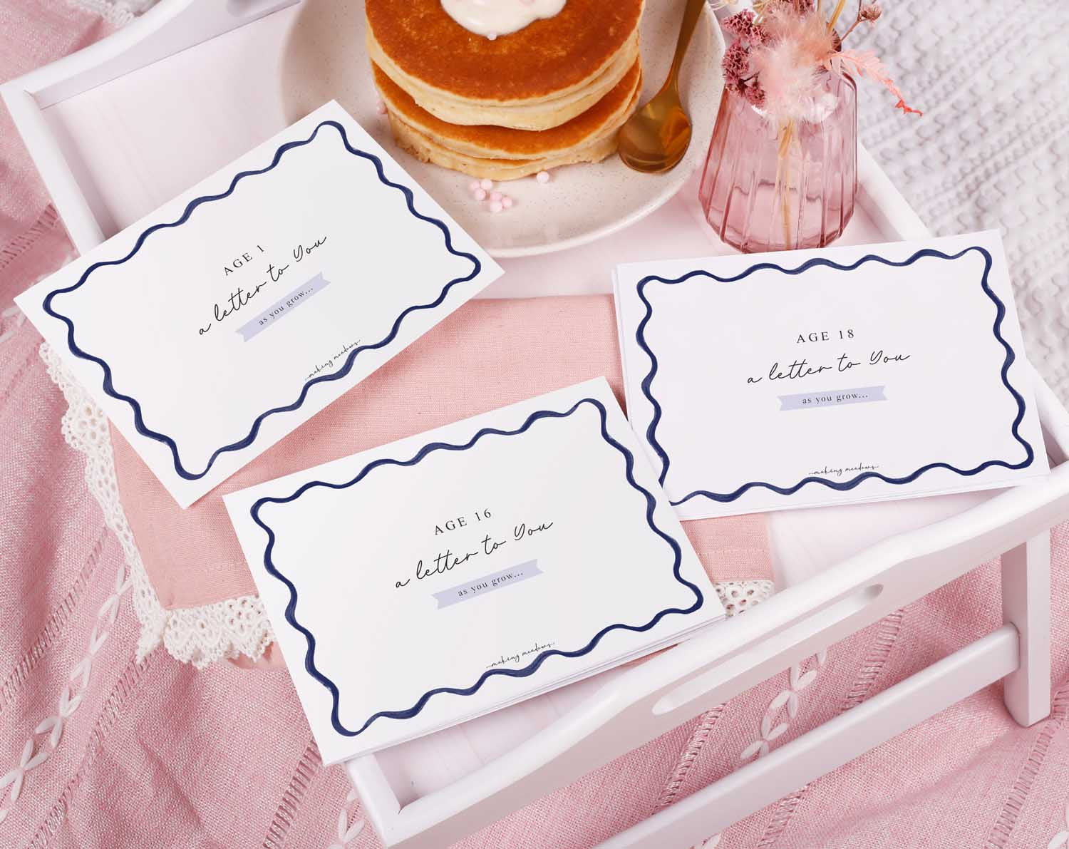 Personalised Blue Wavy Letter To Our Son displayed on a tray with pancakes and flowers, perfect for sentimental keepsakes.