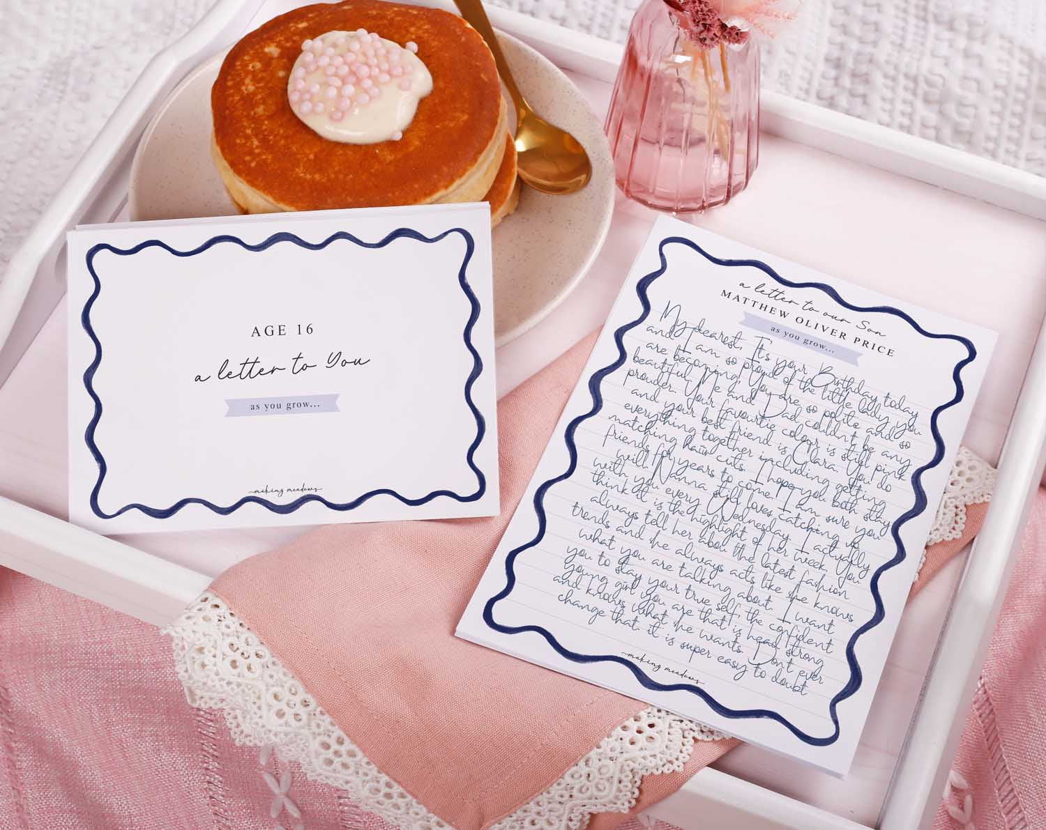 Personalised Blue Wavy Letter To Our Son displayed with a pancake and floral decor on a tray.