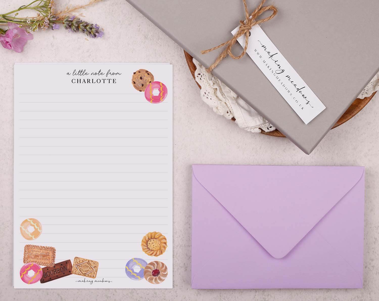 Personalised Children's Stationery Set featuring biscuit design writing paper and a purple envelope.