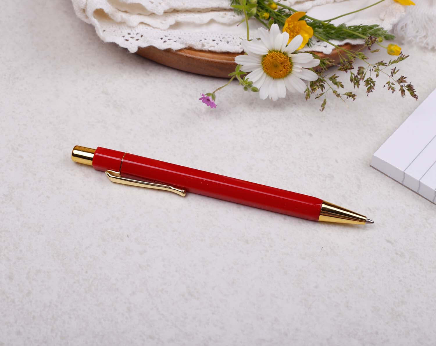 luxury red and gold ballpoint pen with hexagonal barrel