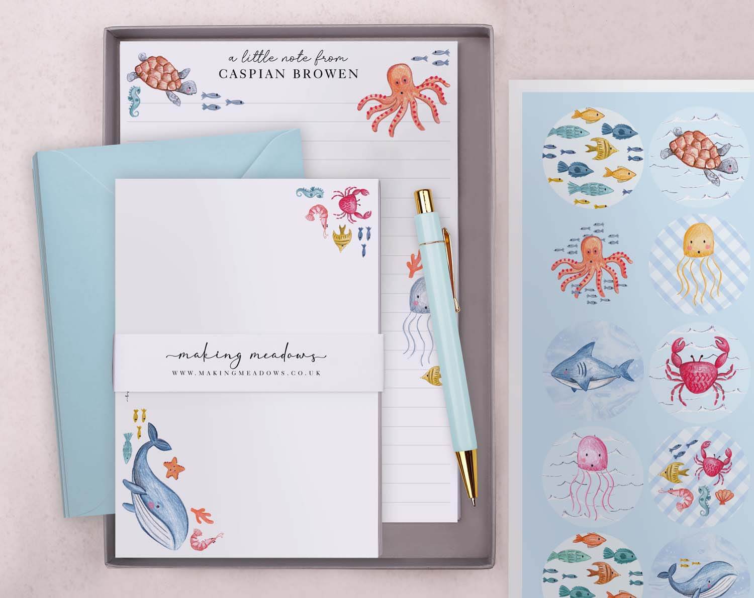 Personalised Children's Stationery Set featuring under the sea design with colourful envelopes and pen.