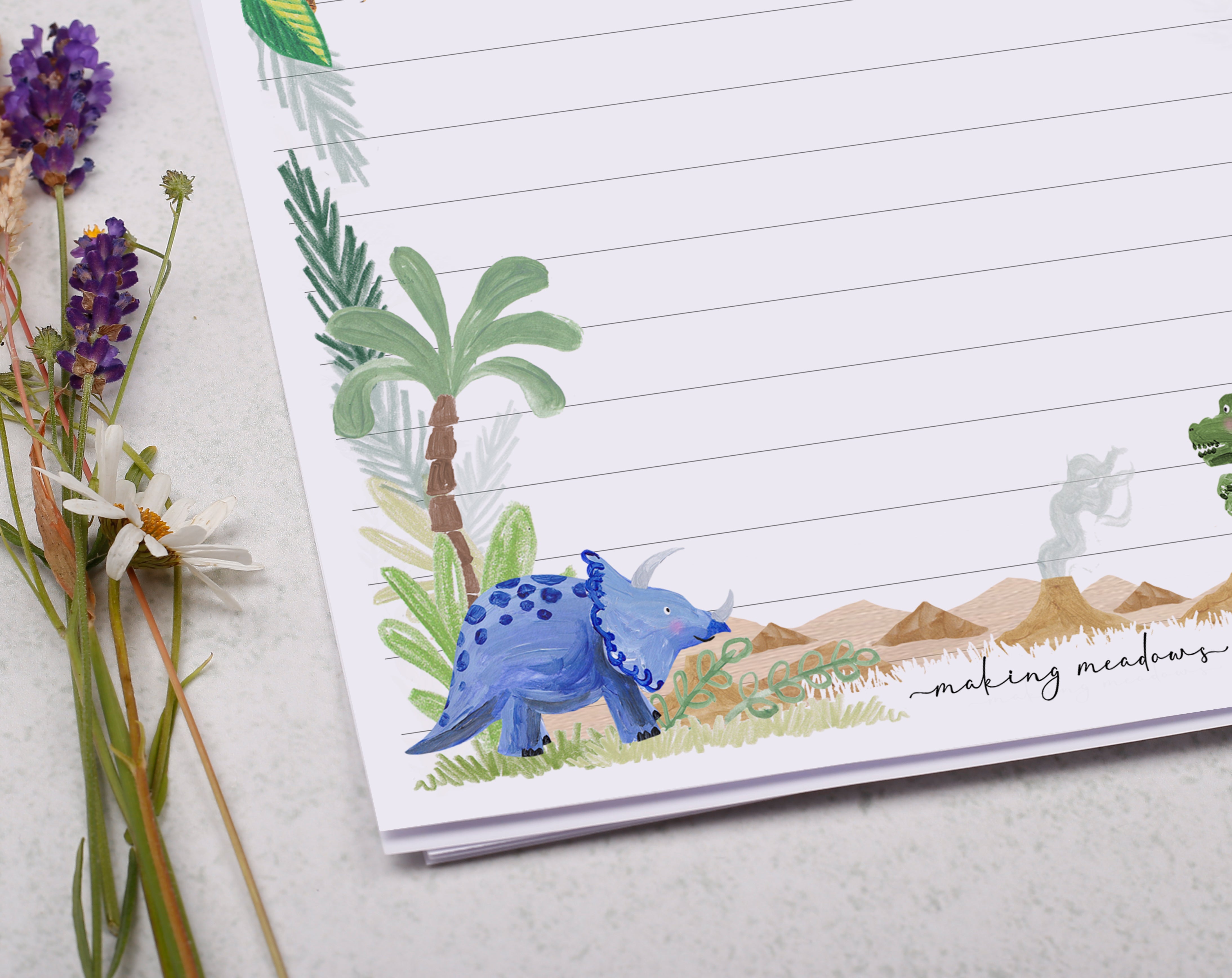 Premium personalised A5 letter writing paper set for children with a cute dinosaur in the jungle design.