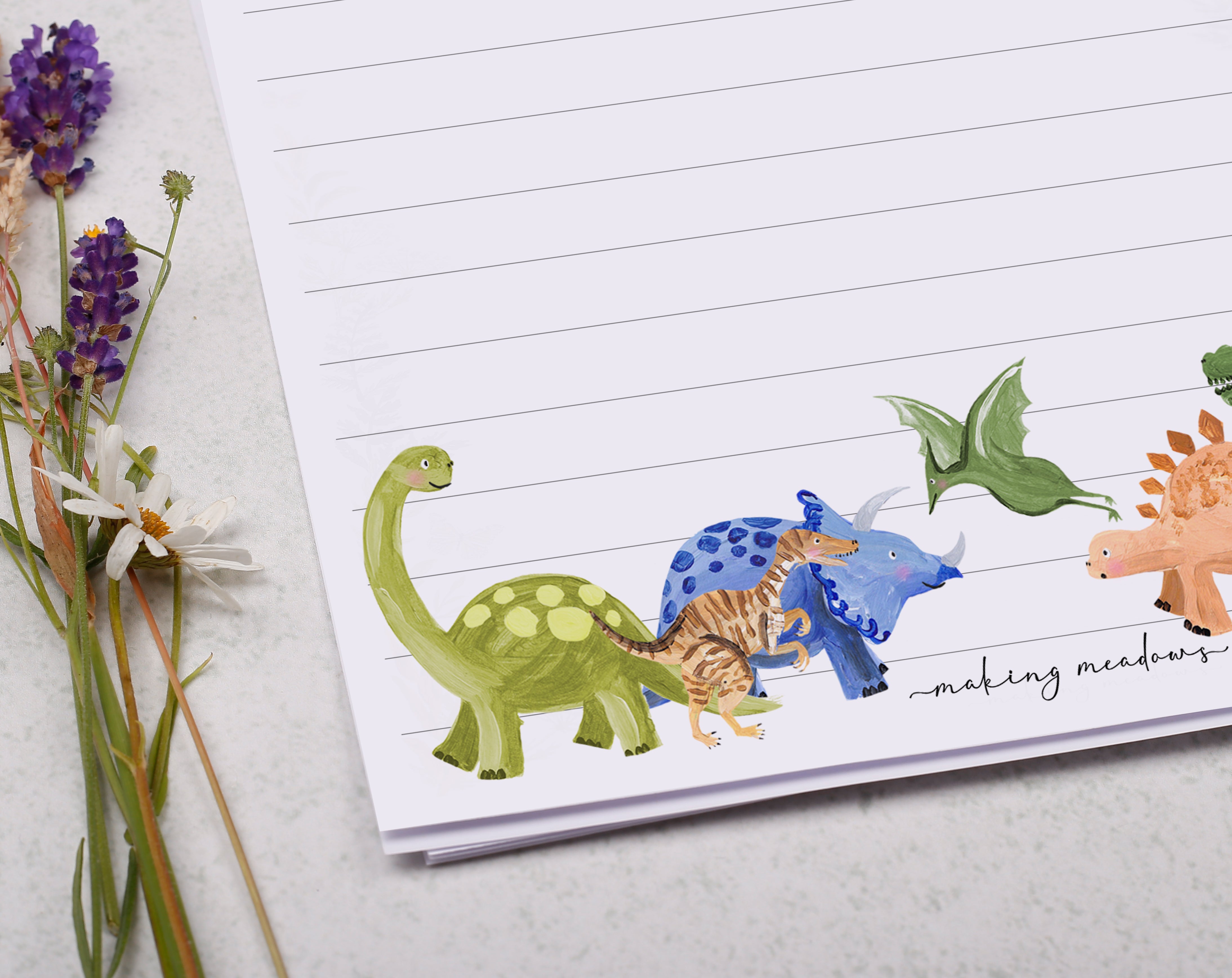 Premium personalised A5 letter writing paper set for children with a cute prehistoric dinosaur design. 