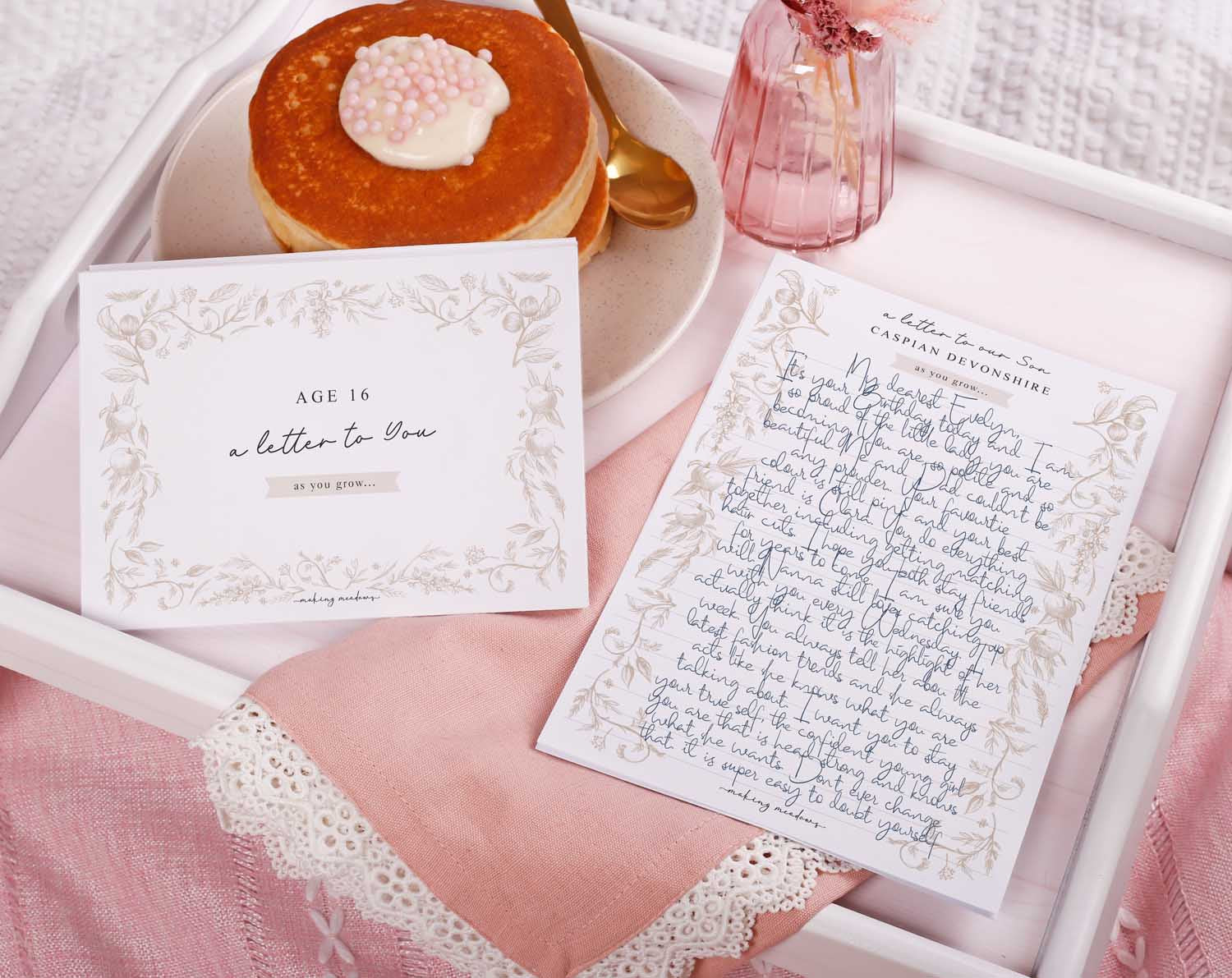 Personalised Neutral Letter To Our Son with decorative letter writing paper and a sweet treat on a tray.