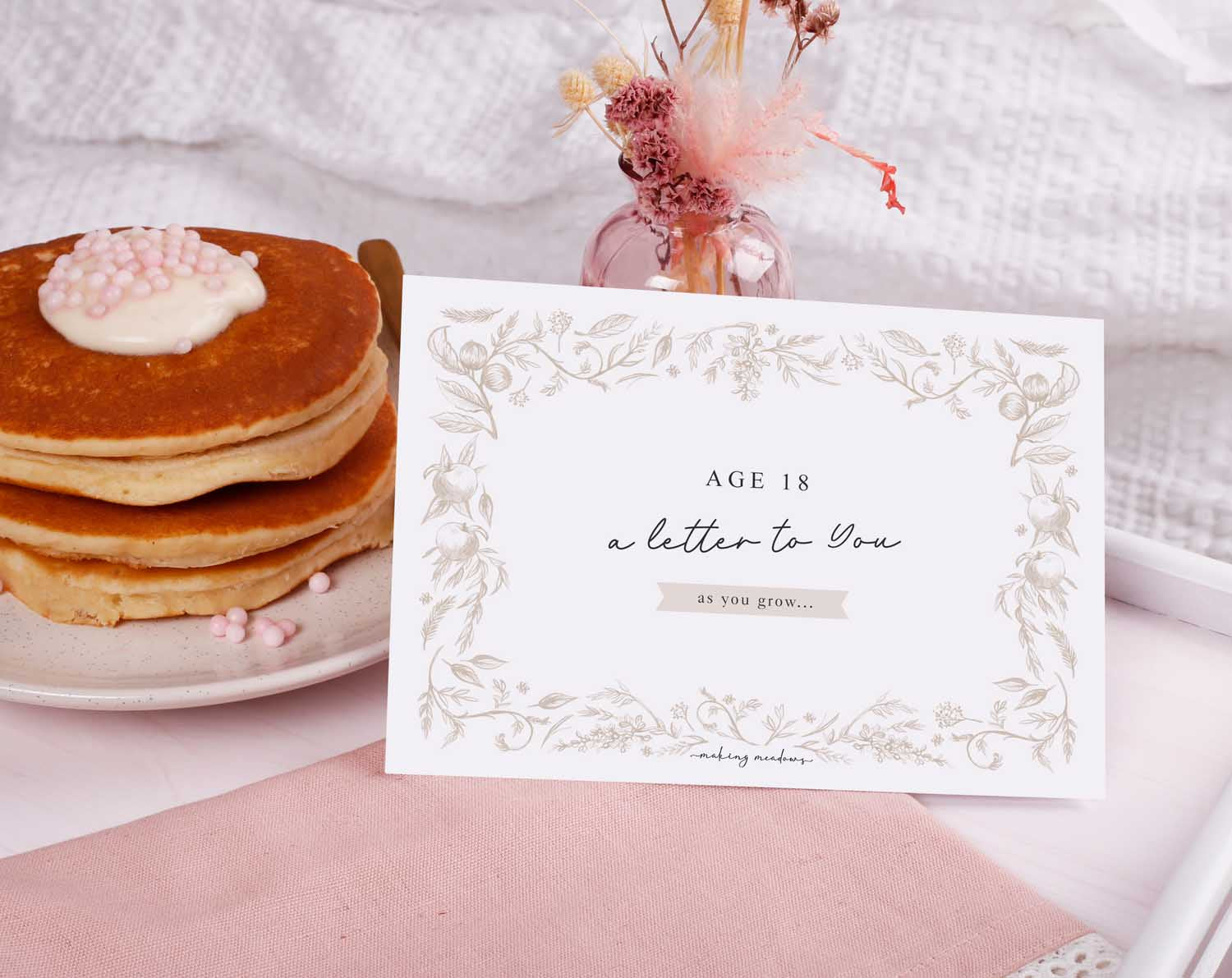 Personalised Neutral Letter To Our Son displayed with pancakes and flowers, capturing cherished moments.