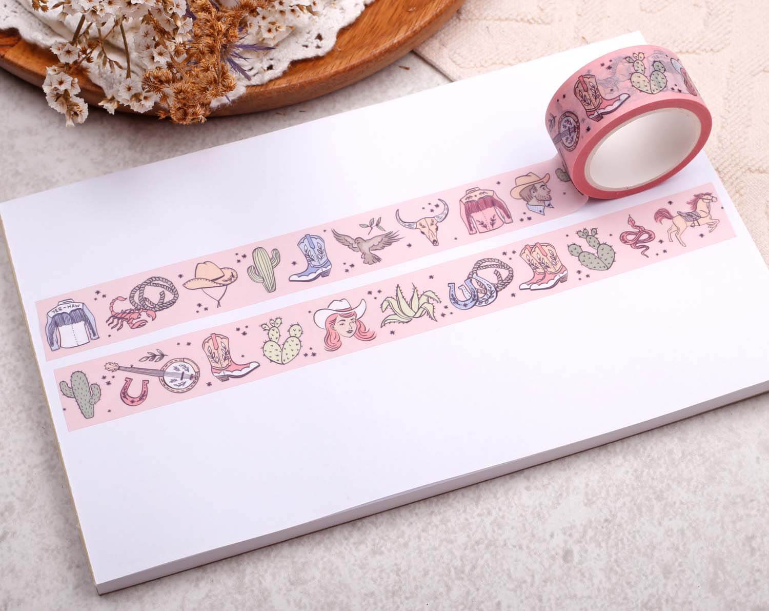 Pink Cowgirl Washi Tape showcased on a white notepad, featuring cute cowgirl-themed illustrations.