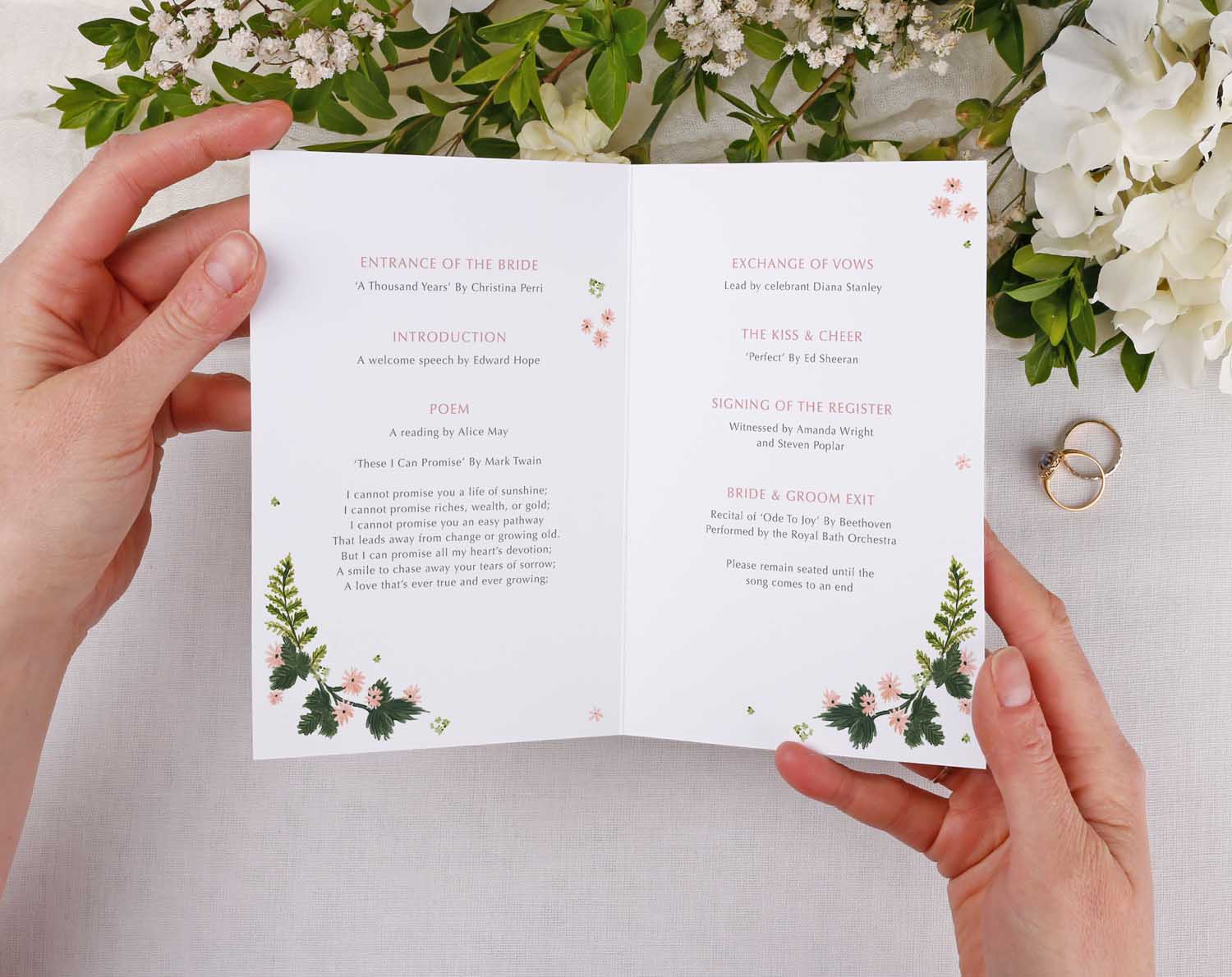 Pink Floral Order Of Service book with pretty floral design and wedding ceremony information.