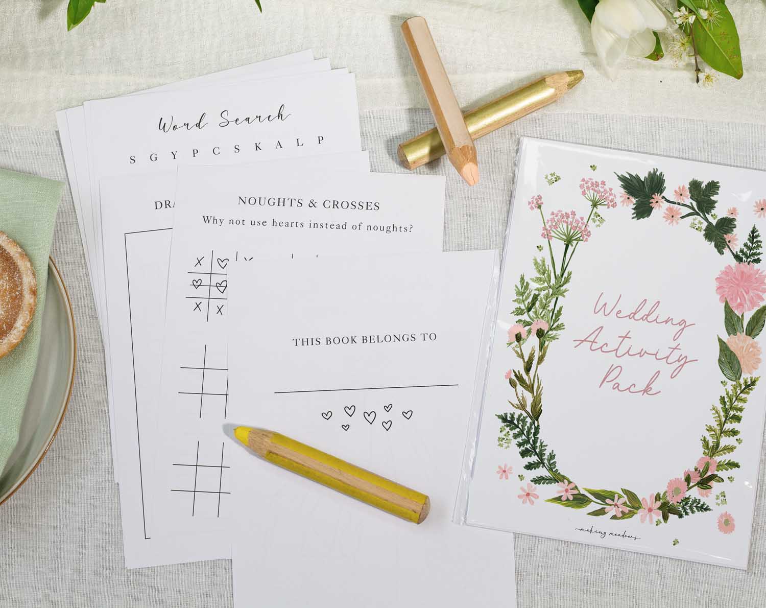 Pink Floral Wedding Kids Activity Pack featuring games, puzzles, and a beautiful cover for kids at weddings.