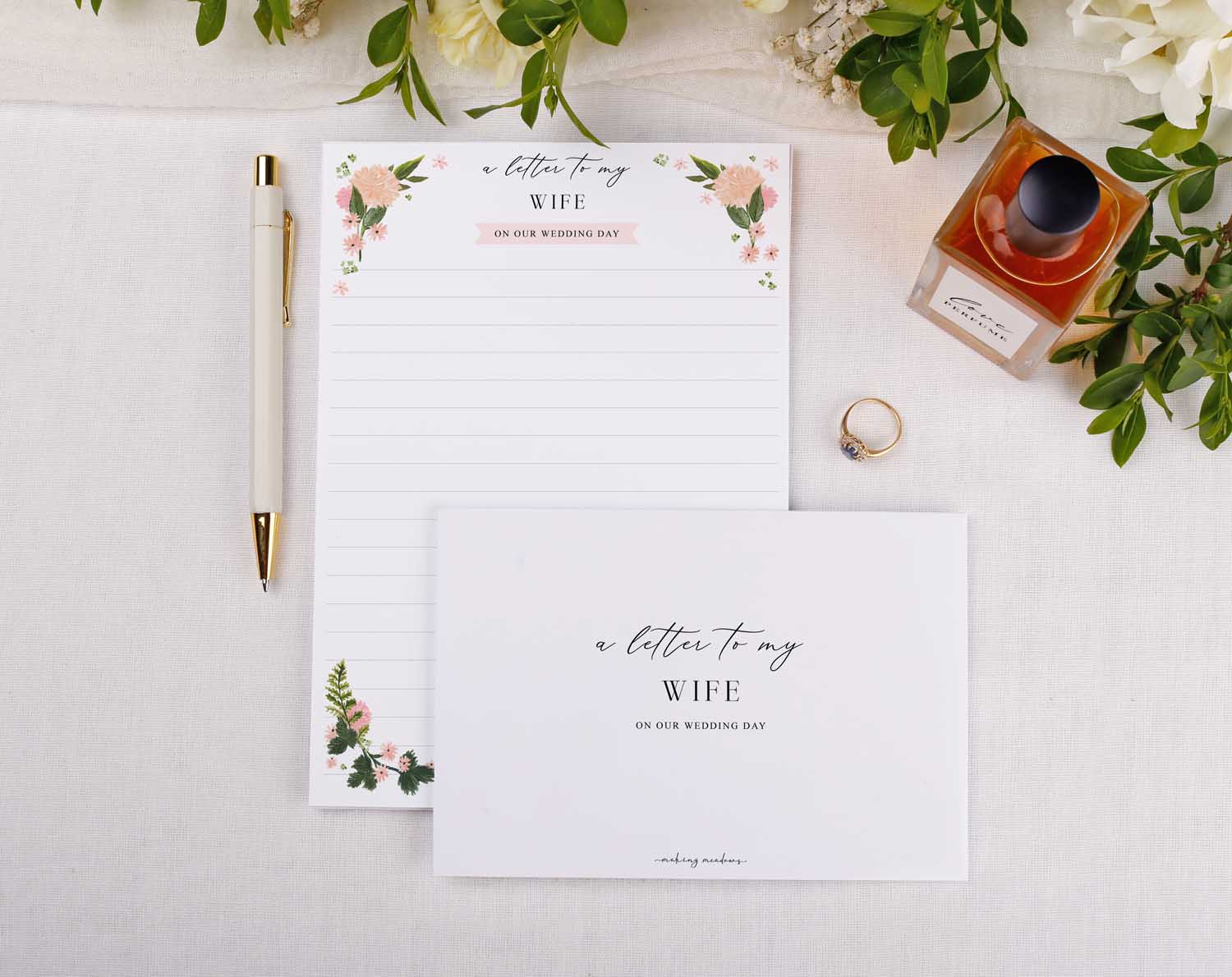 Pink Floral Wedding Letter to My Wife kit featuring A5 writing paper, envelope, pen, and ring displayed on a floral backdrop.