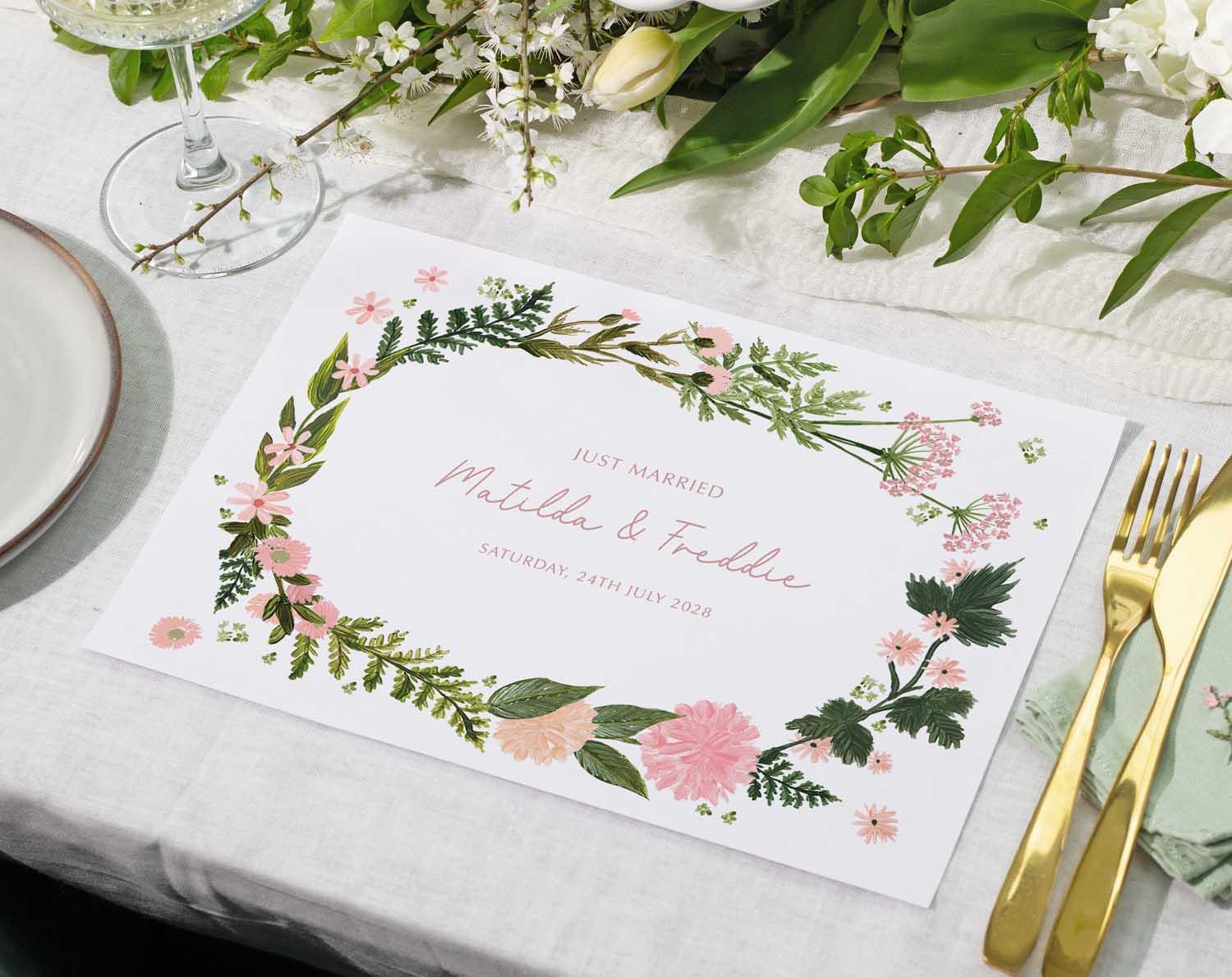 Pink Floral Wedding Placemats with personalised details and fresh flowers and greenery.