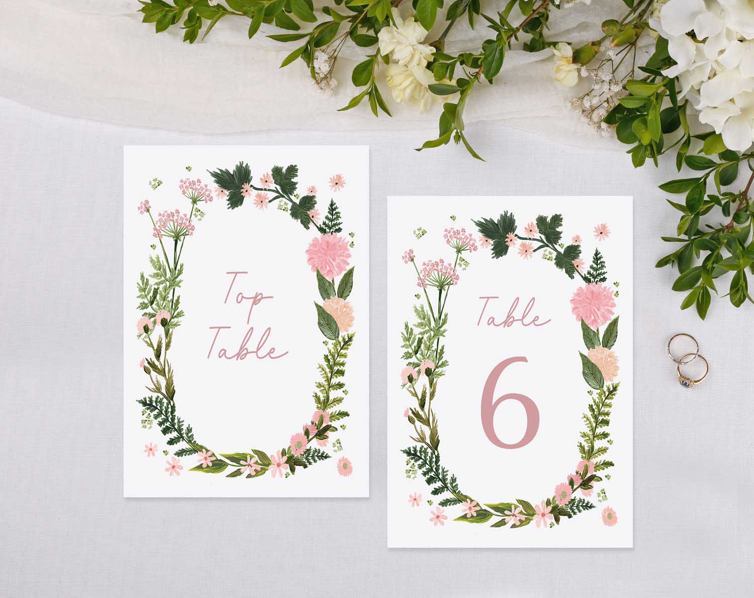Elegant Pink Floral Wedding Table Numbers designed for organizing reception seating.