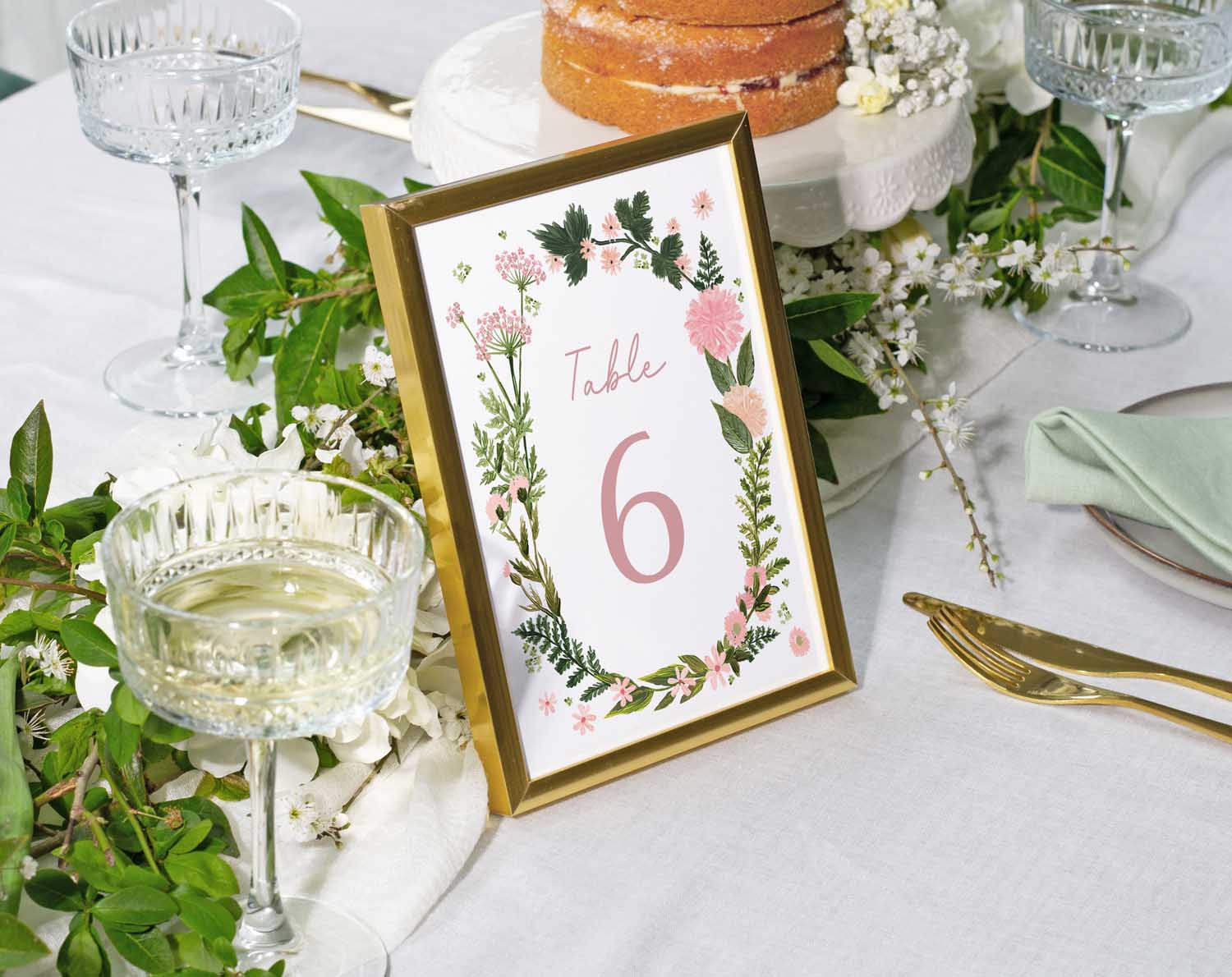 Pink Floral Wedding Table Numbers displayed at a beautifully arranged reception table.