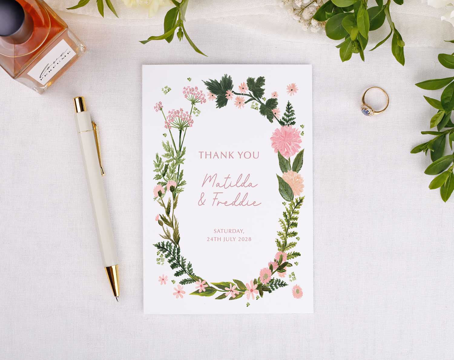 Pink Floral Wedding Thank You Cards featuring a floral design with personalized names and date.