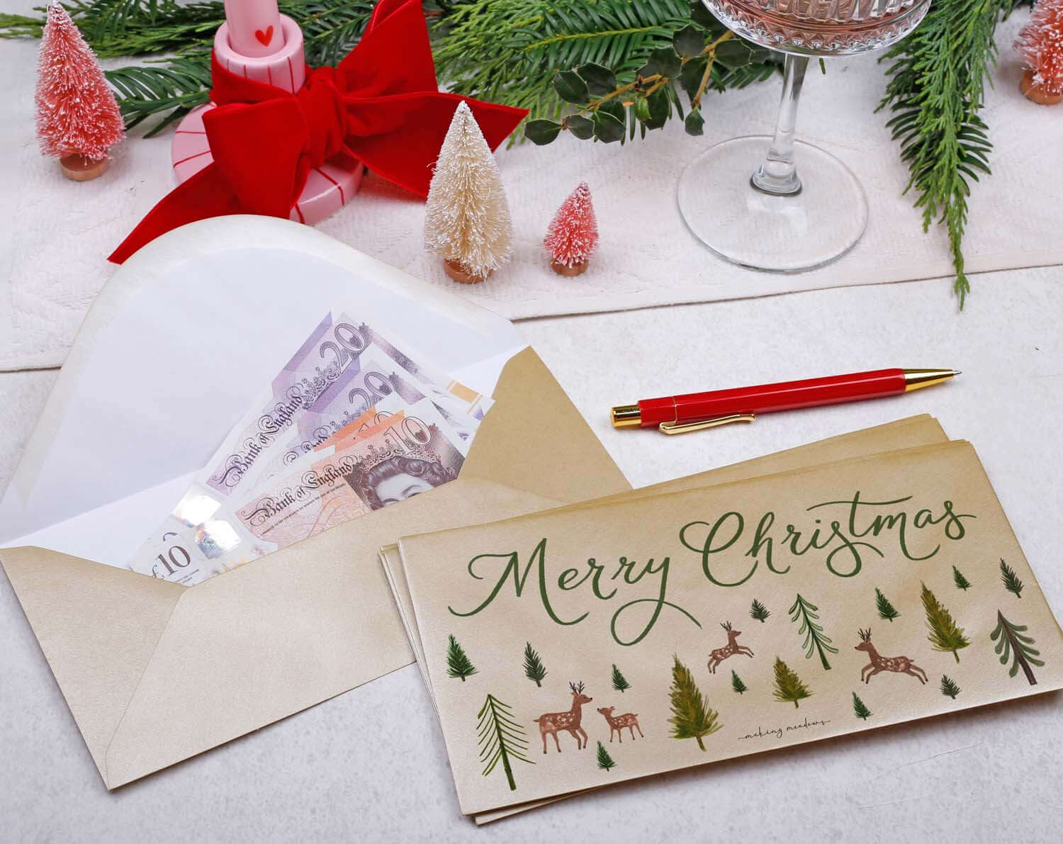 Reindeer Christmas Money Envelopes with money inside, decorated for a festive holiday season.