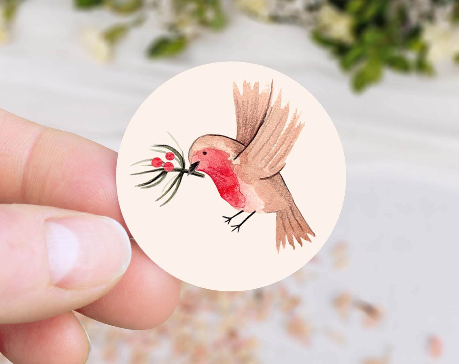 Illustration of a robin holding mistletoe, featured in Robin Christmas Stickers.
