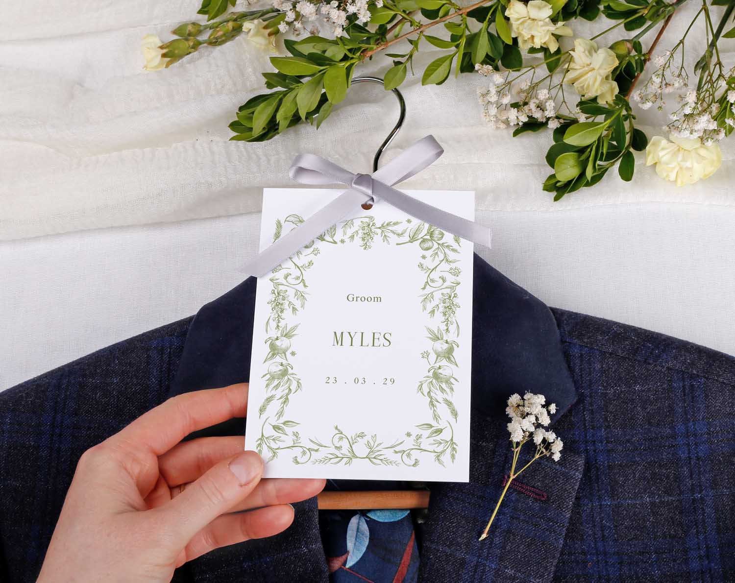 Sage Garden Wedding Hanger Tags for Groom Myles on suit with greenery bouquet, perfect for wedding morning photos.