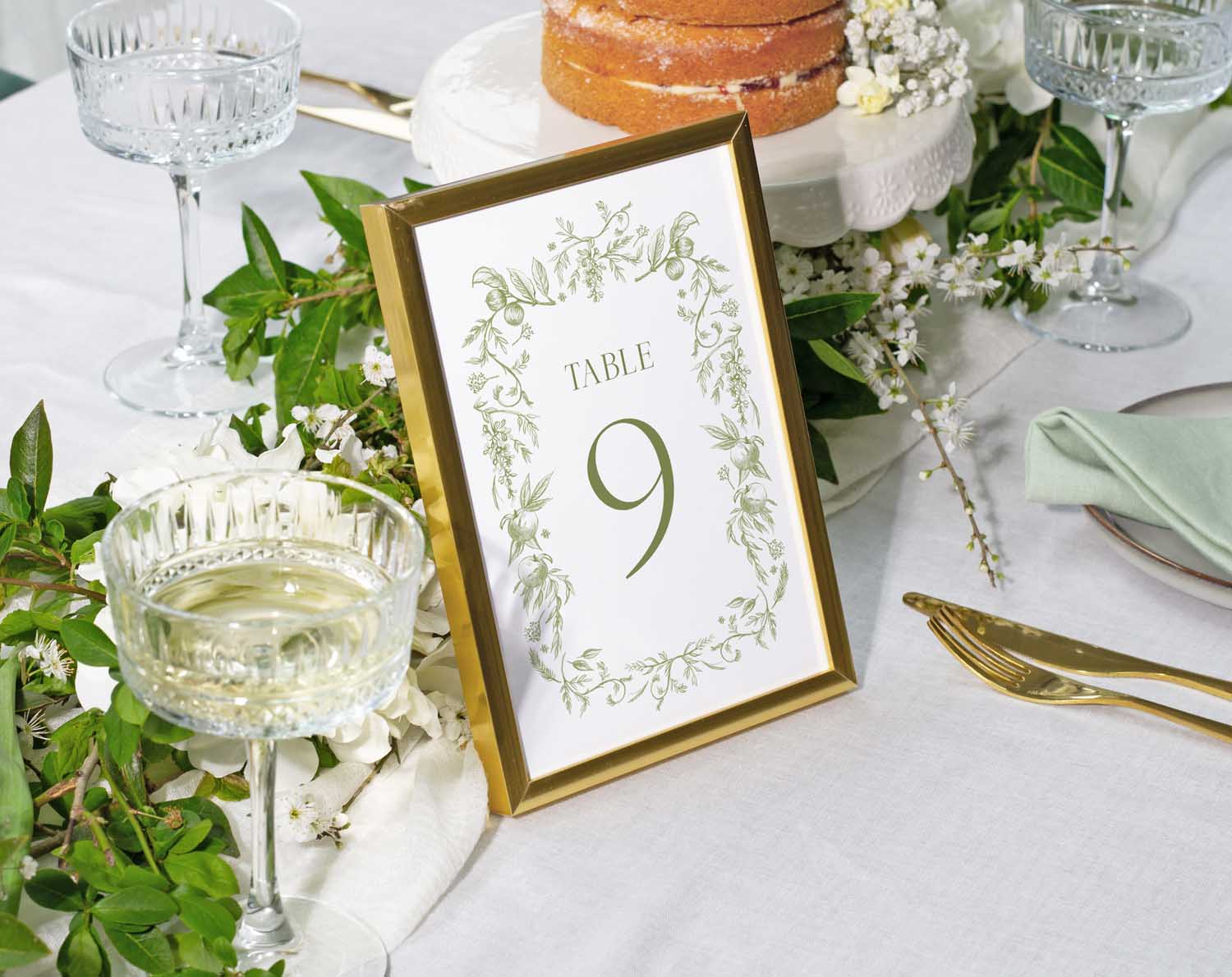 Sage Garden Wedding Table Numbers displayed at a beautifully styled reception table, featuring greenery and floral elements.