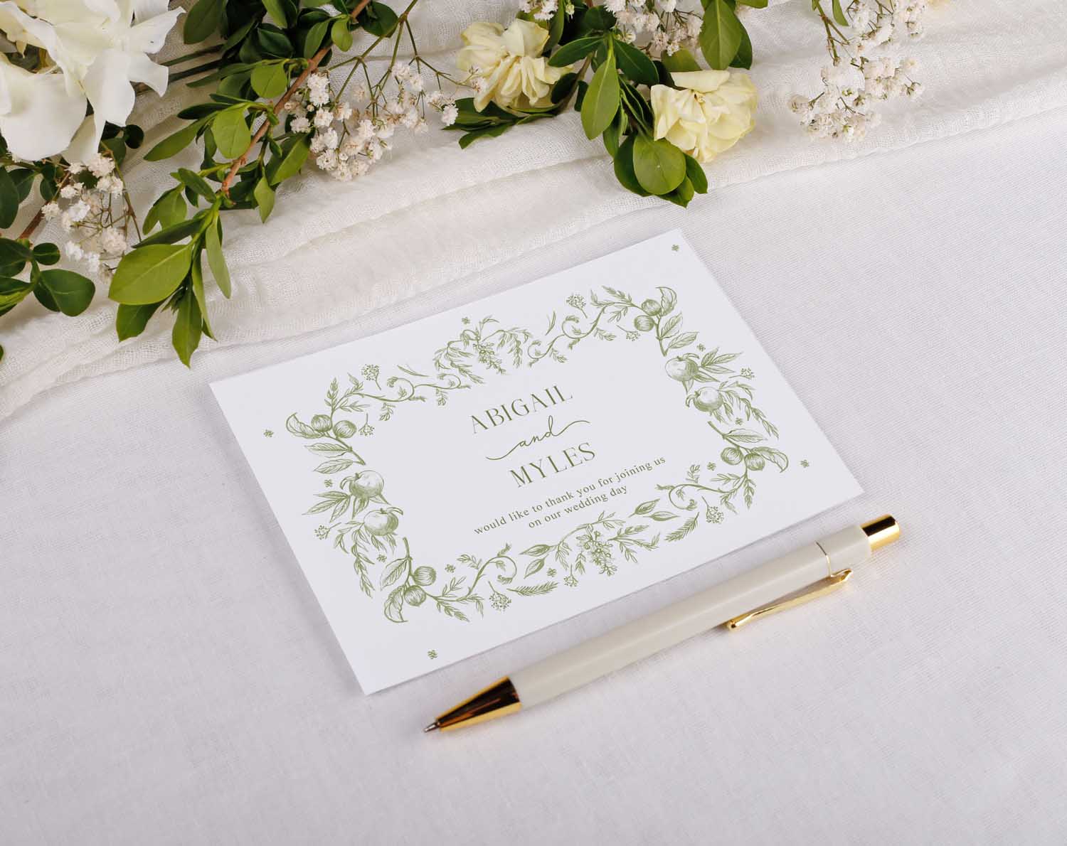 Sage Garden Wedding Thank You Postcards featuring elegant floral design and pen on a soft surface.