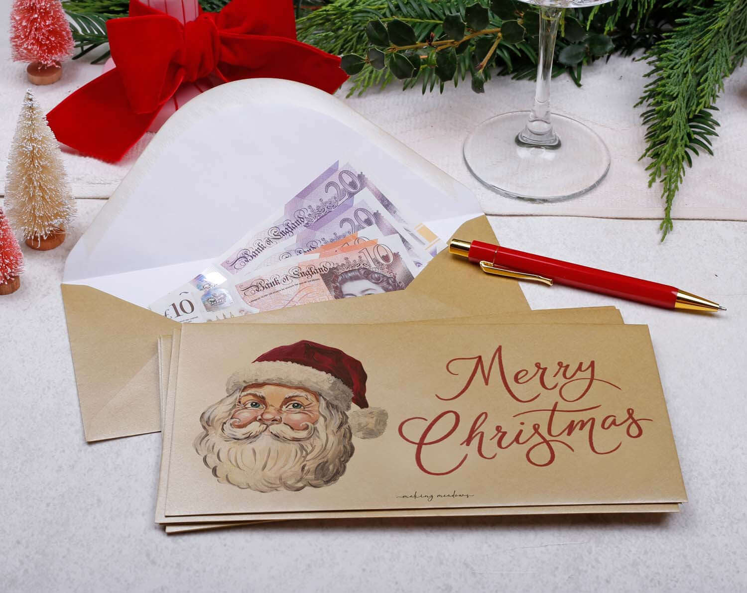 Santa Christmas Money Envelopes with a cheerful Santa illustration and cash inside, perfect for holiday gifting.