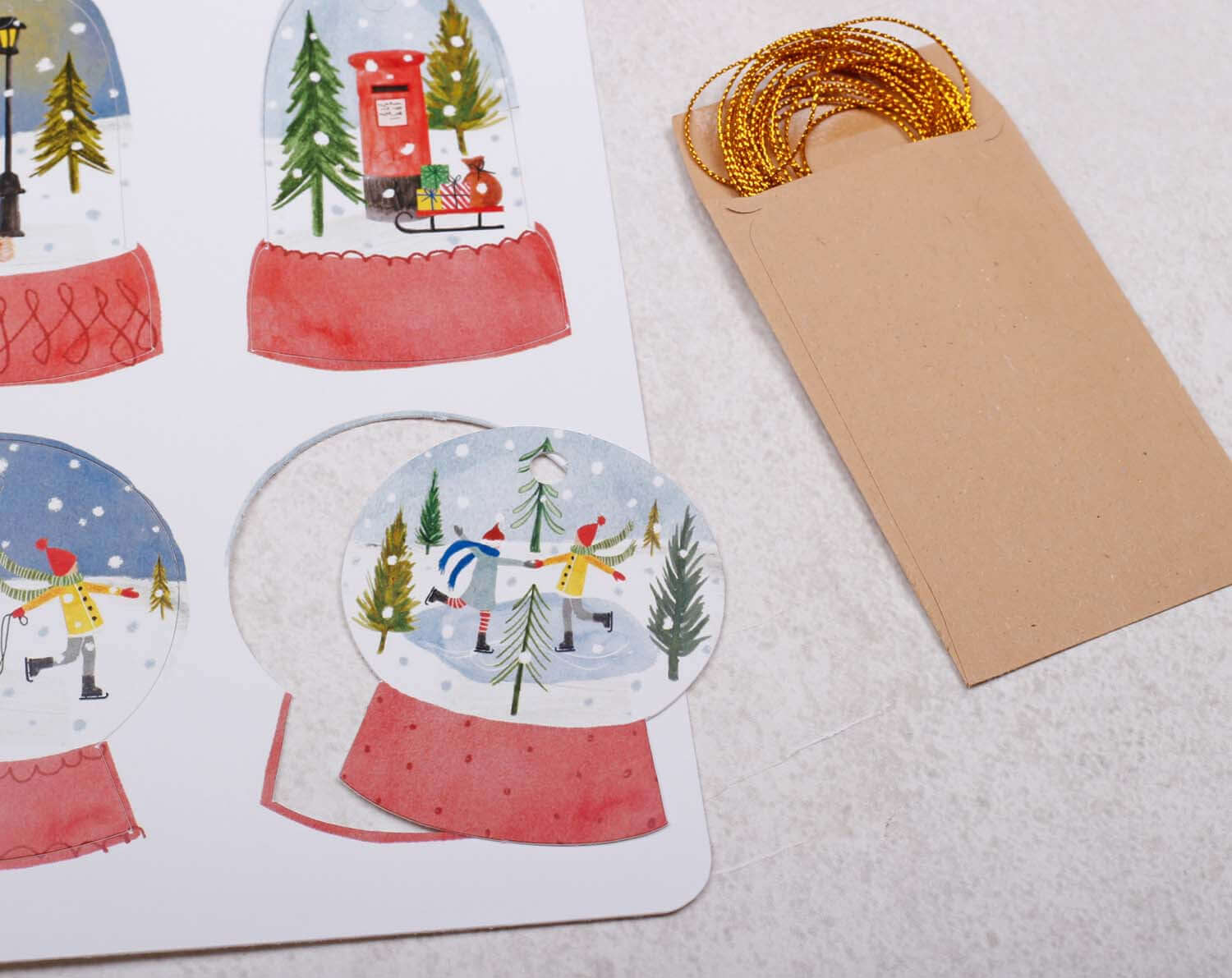 Snow Globe Christmas Gift Tags featuring winter scenes and a blank tag for personalizing gifts.