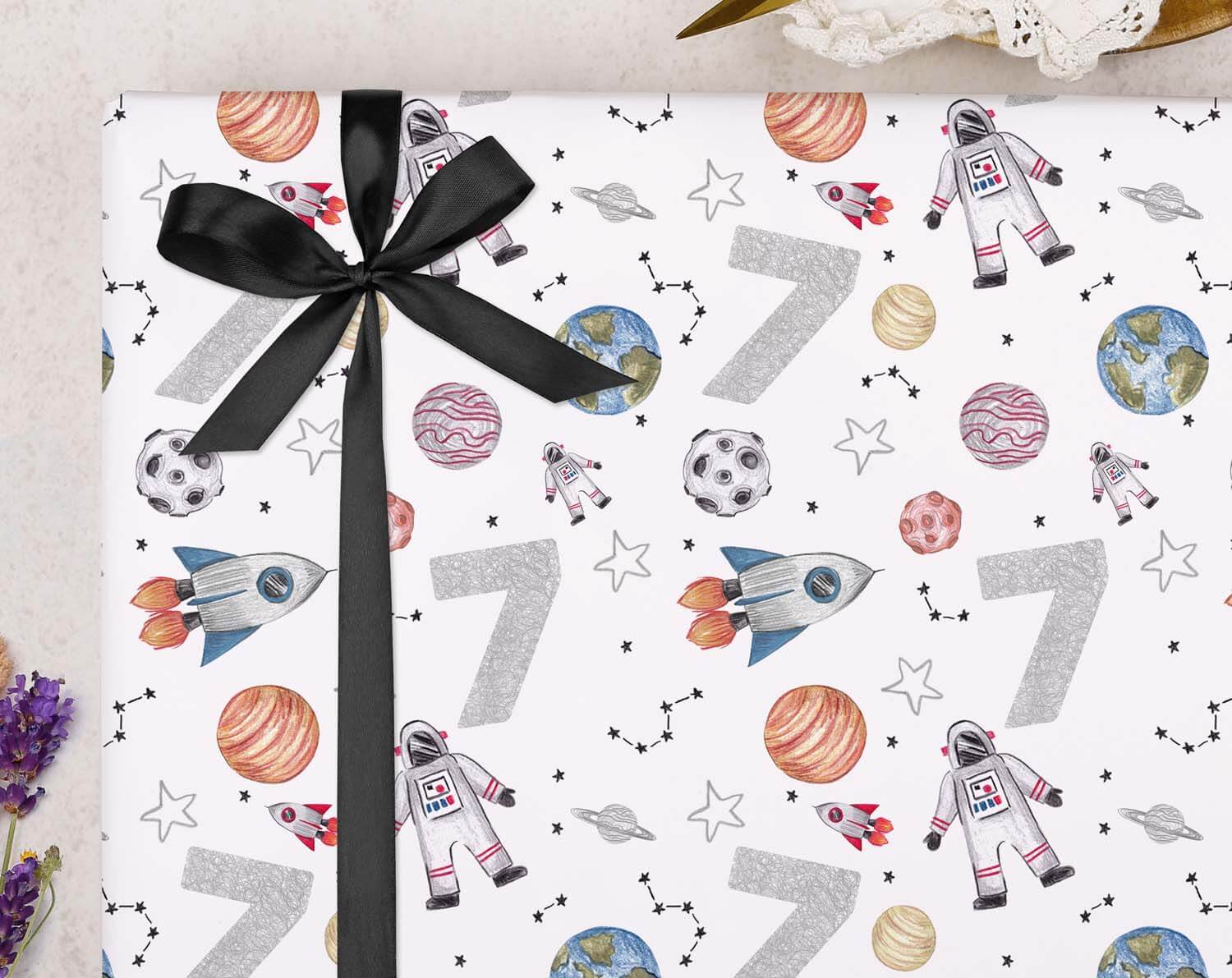 Space 7th Birthday Wrapping Paper featuring rockets, planets, and astronauts in a colorful pattern.