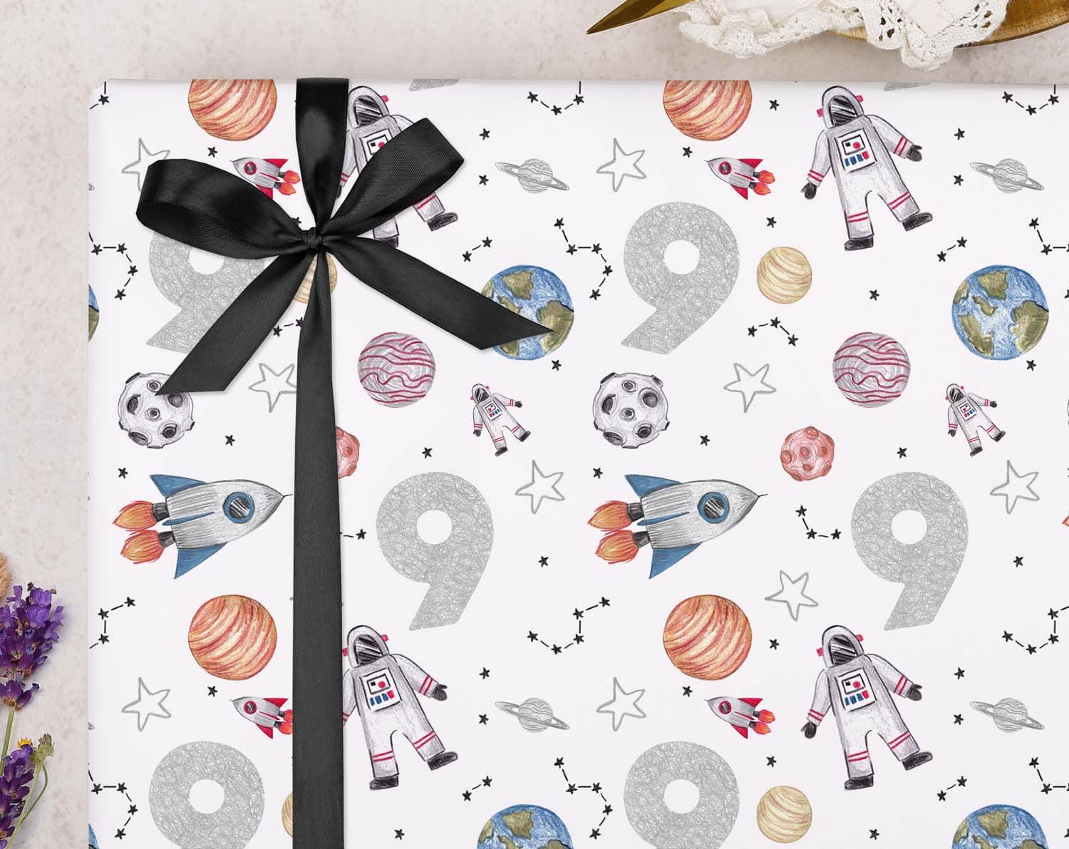 Space 9th Birthday Wrapping Paper featuring rockets, planets, and astronauts in a fun design.