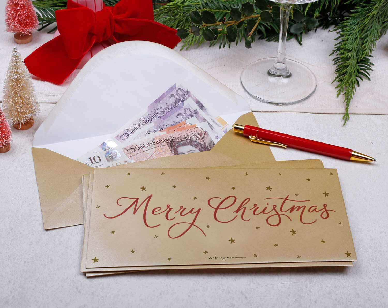 Star Christmas Money Envelopes featuring a festive design with cash inside, adding sparkle to holiday gifting.