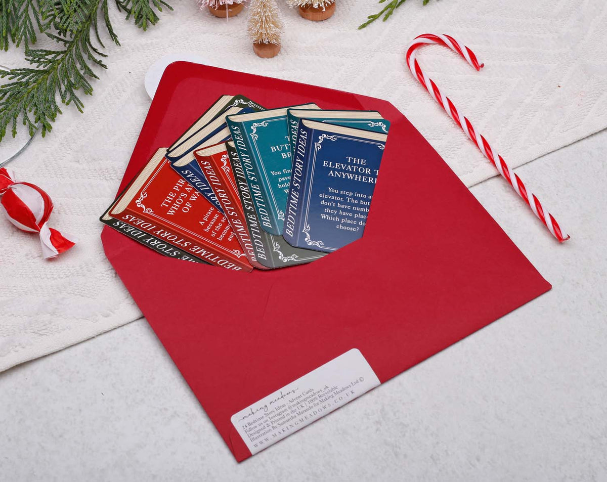 Story Book Idea Advent Calendar with colorful story cards in a red envelope, perfect for bedtime creativity.