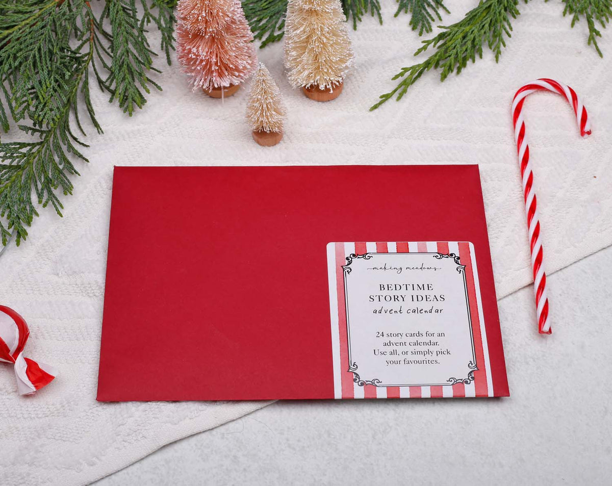 Story Book Idea Advent Calendar with 24 bedtime story idea cards, festive decoration, and candy cane.