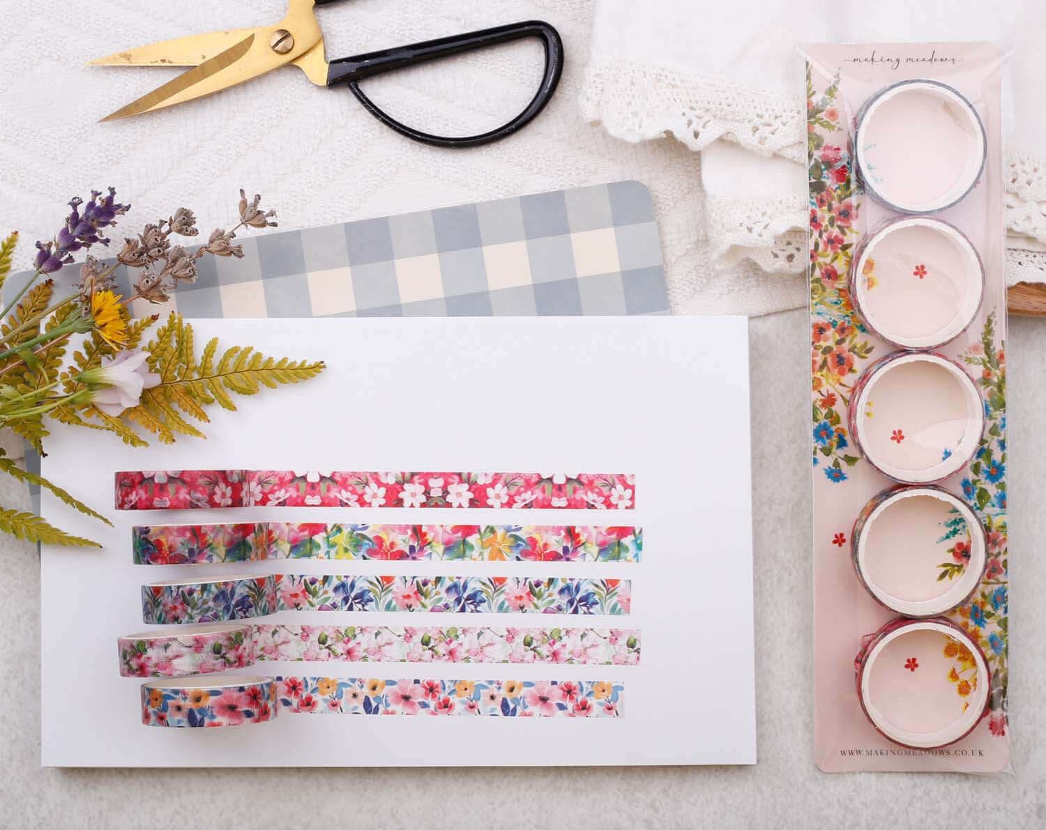 Tropical Floral Washi Tape variety pack displayed on a surface with scissors and decorative foliage.