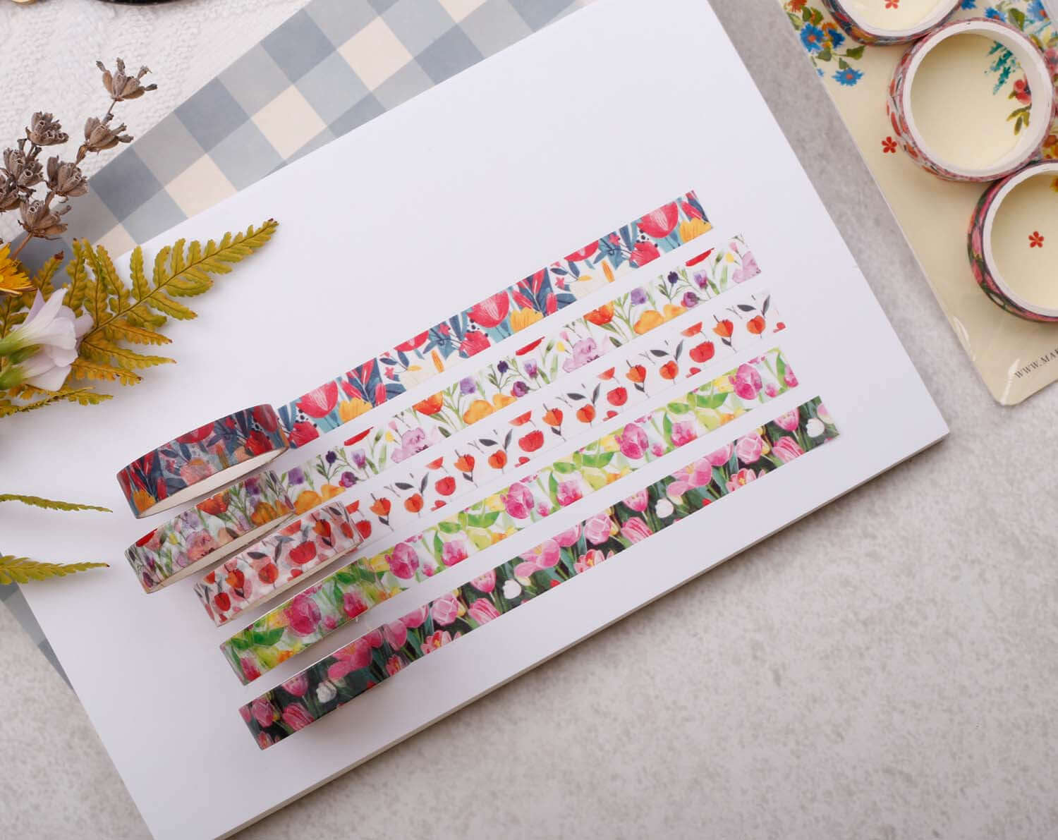 Tulip Floral Washi Tape Variety Pack displayed on a flat surface with floral designs and decorative elements.