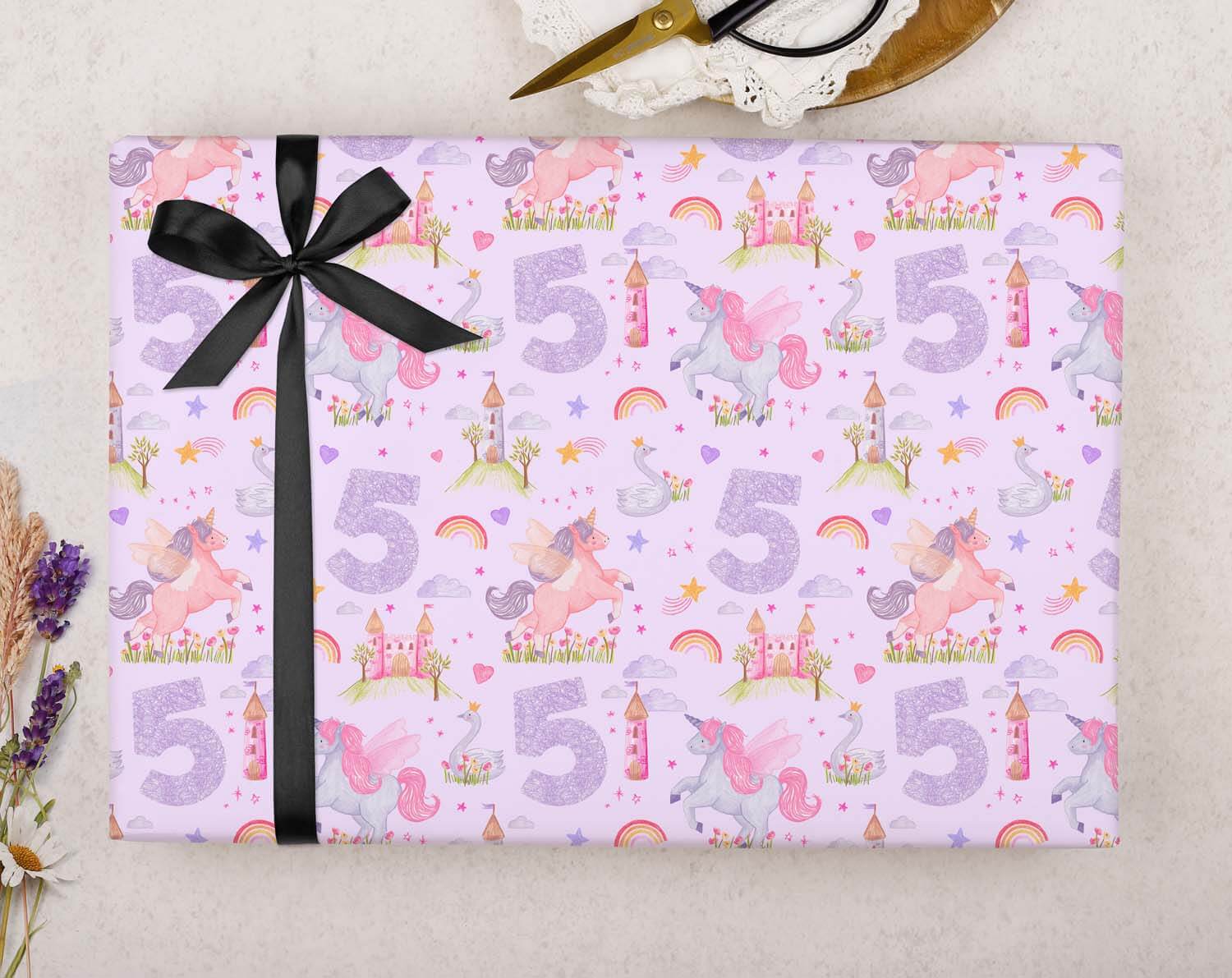 Unicorn 5th Birthday Wrapping Paper featuring a colorful design with unicorns and castles, perfect for a child's birthday gift.