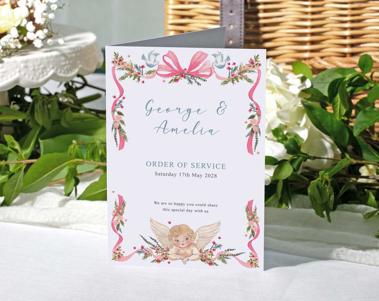 Vintage Order Of Service with floral design, featuring cherub illustration and pink ribbon for wedding ceremony.