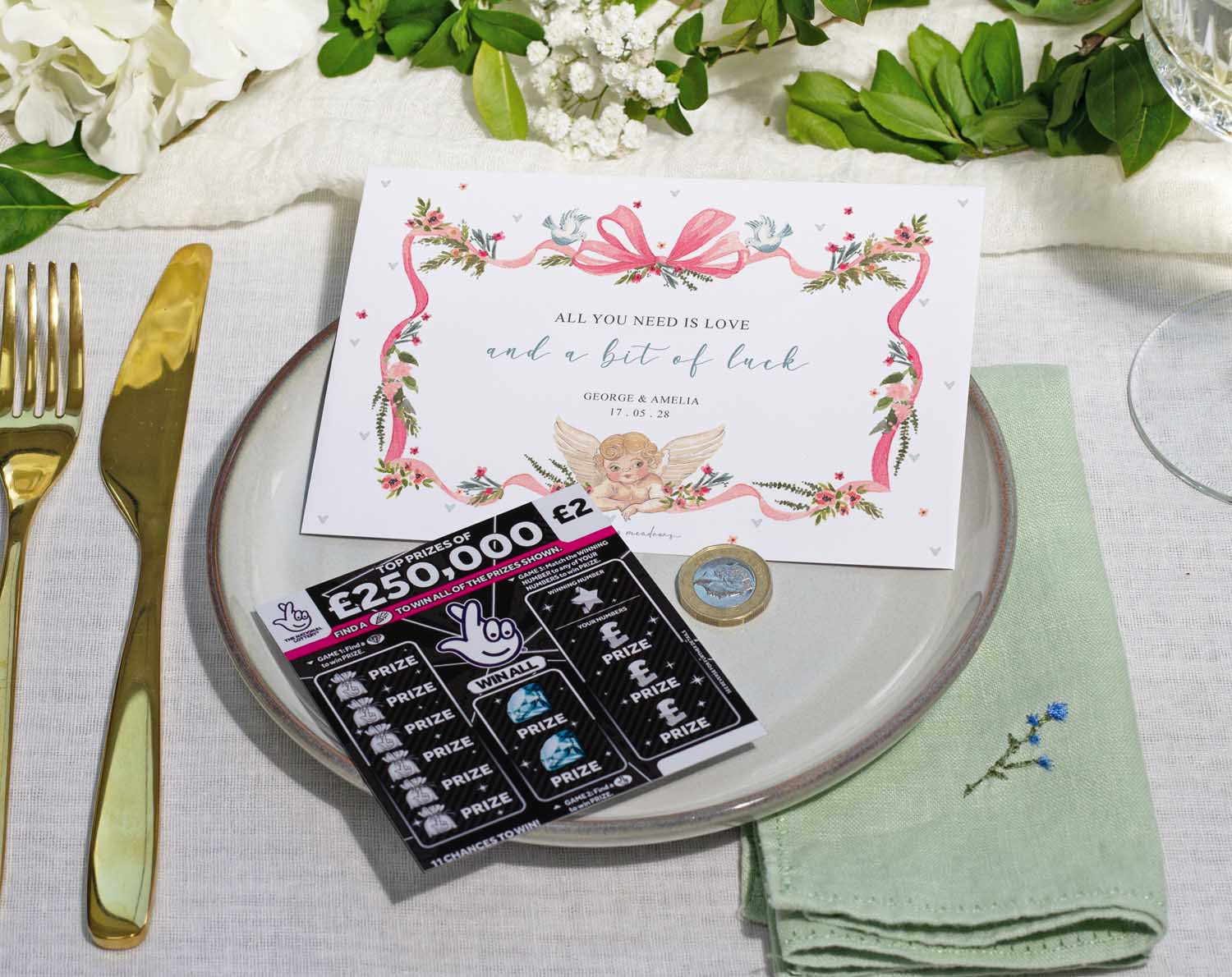 Vintage Scratch Card Envelopes on a wedding table setting with scratch cards and a decorative plate.