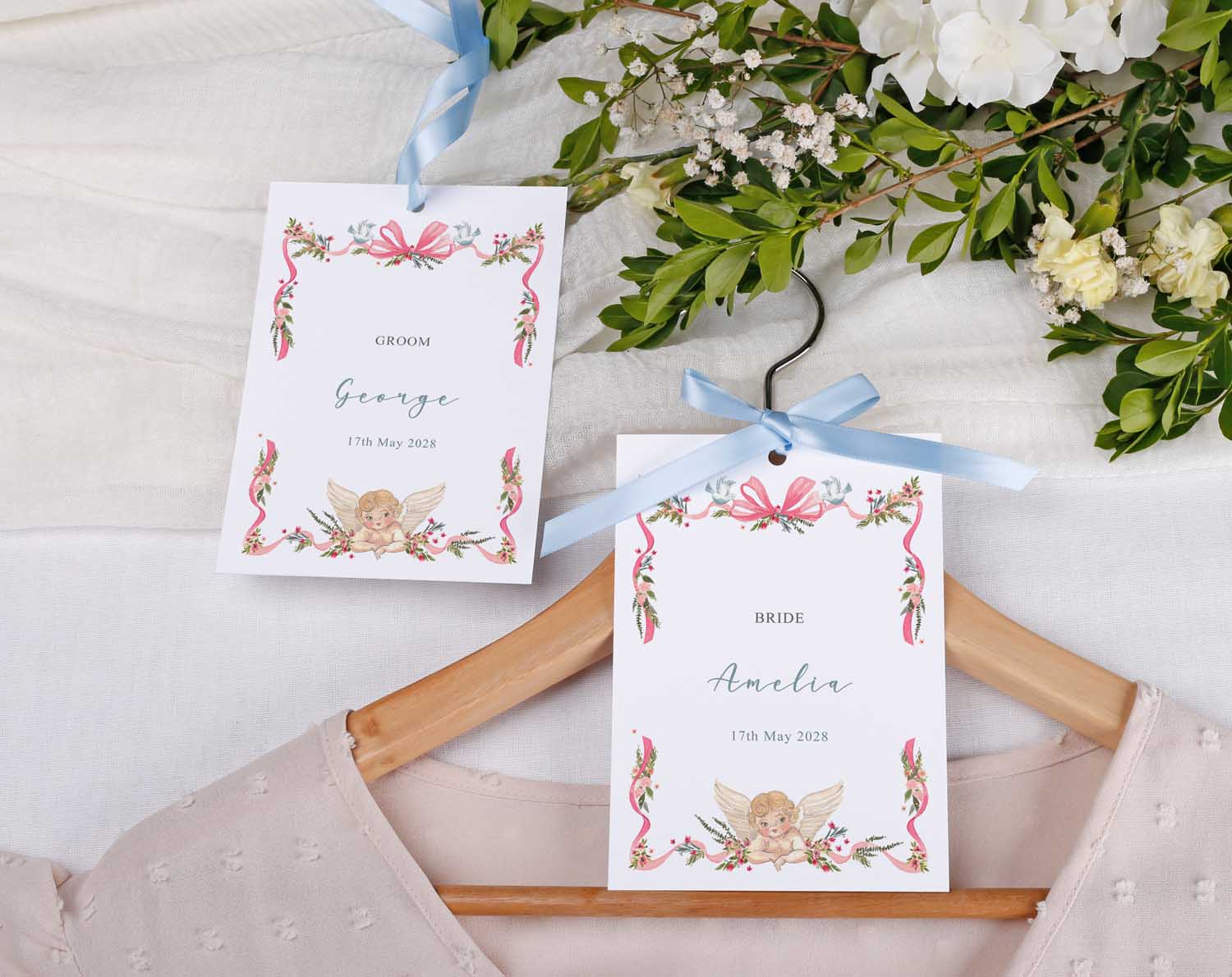 Vintage Wedding Hanger Tags for bride and groom with floral design and ribbons, enhancing wedding morning photos.