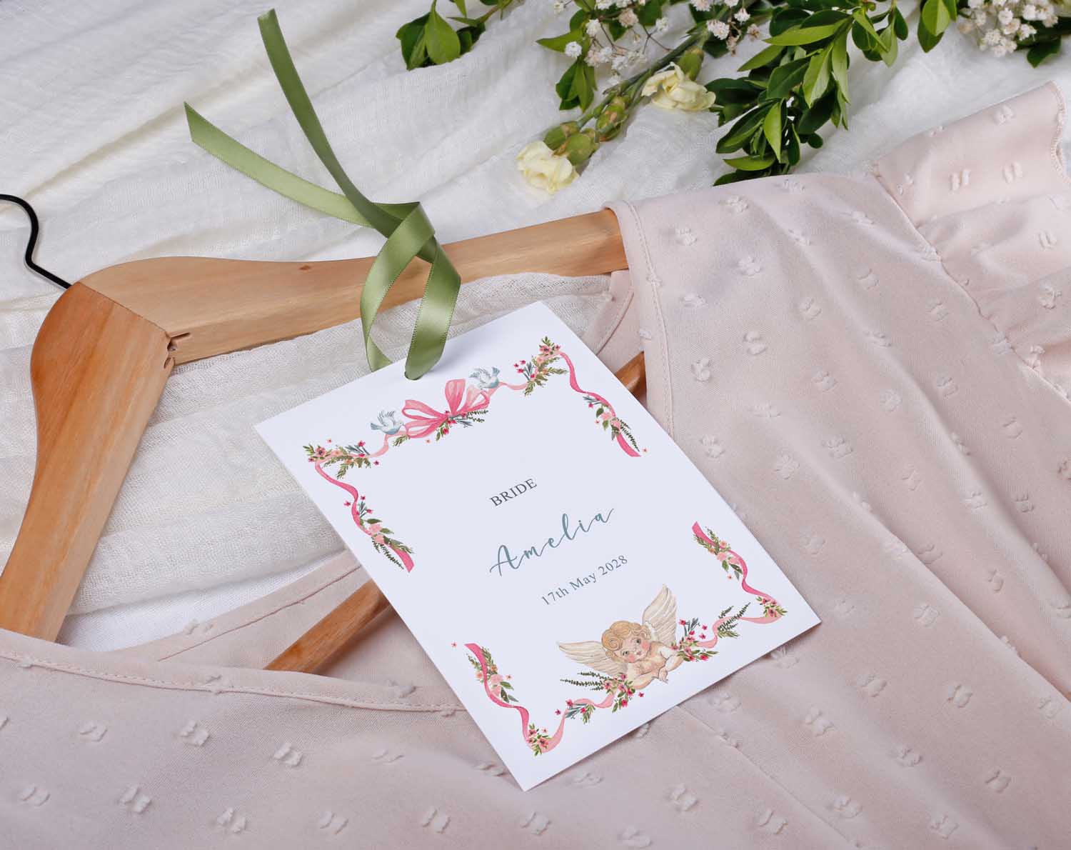 Vintage Wedding Hanger Tags personalized for bride Amelia's wedding outfit on hanger with floral design.
