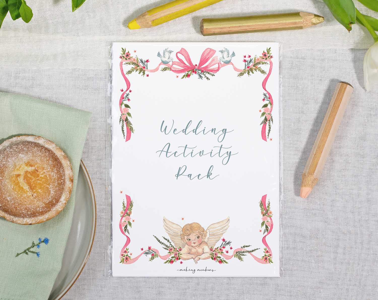 Vintage Wedding Kids Activity Pack displayed elegantly on a table with decorative borders and a cute angel illustration.