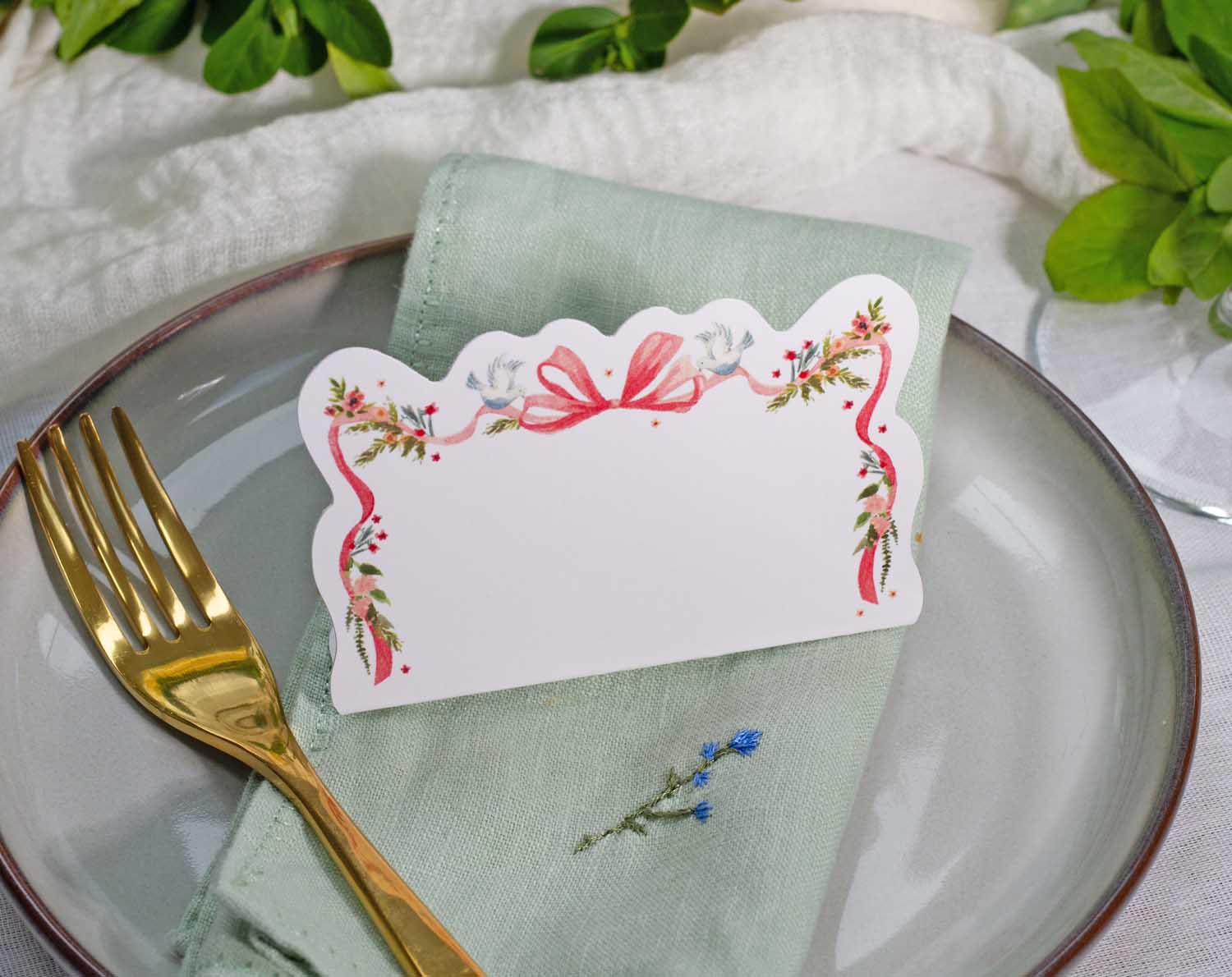 Vintage Wedding Place Cards elegantly displayed on a table setting with a fork and napkin.