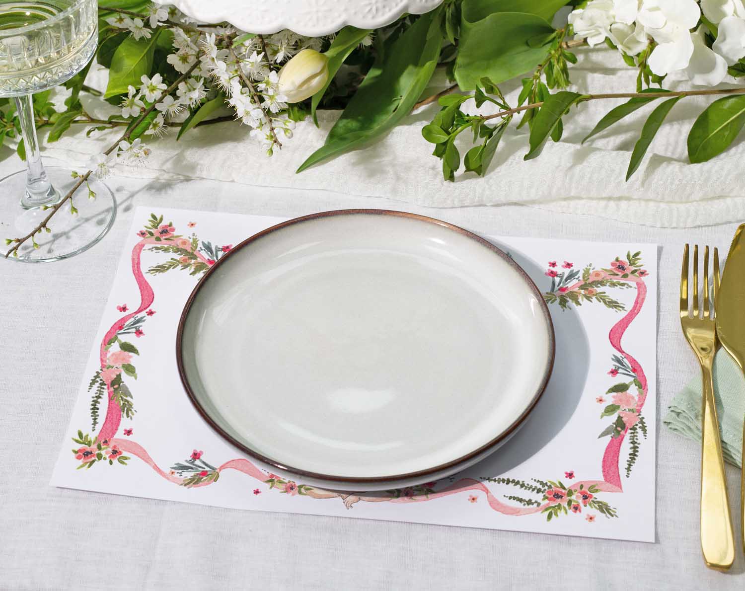 Vintage Wedding Placemats with floral design under a round plate for elegant table settings.