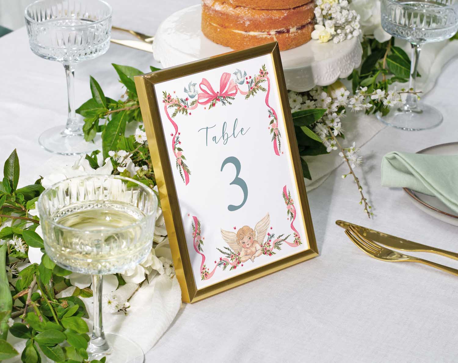 Vintage Wedding Table Numbers displayed in an elegant frame on a beautifully arranged table.