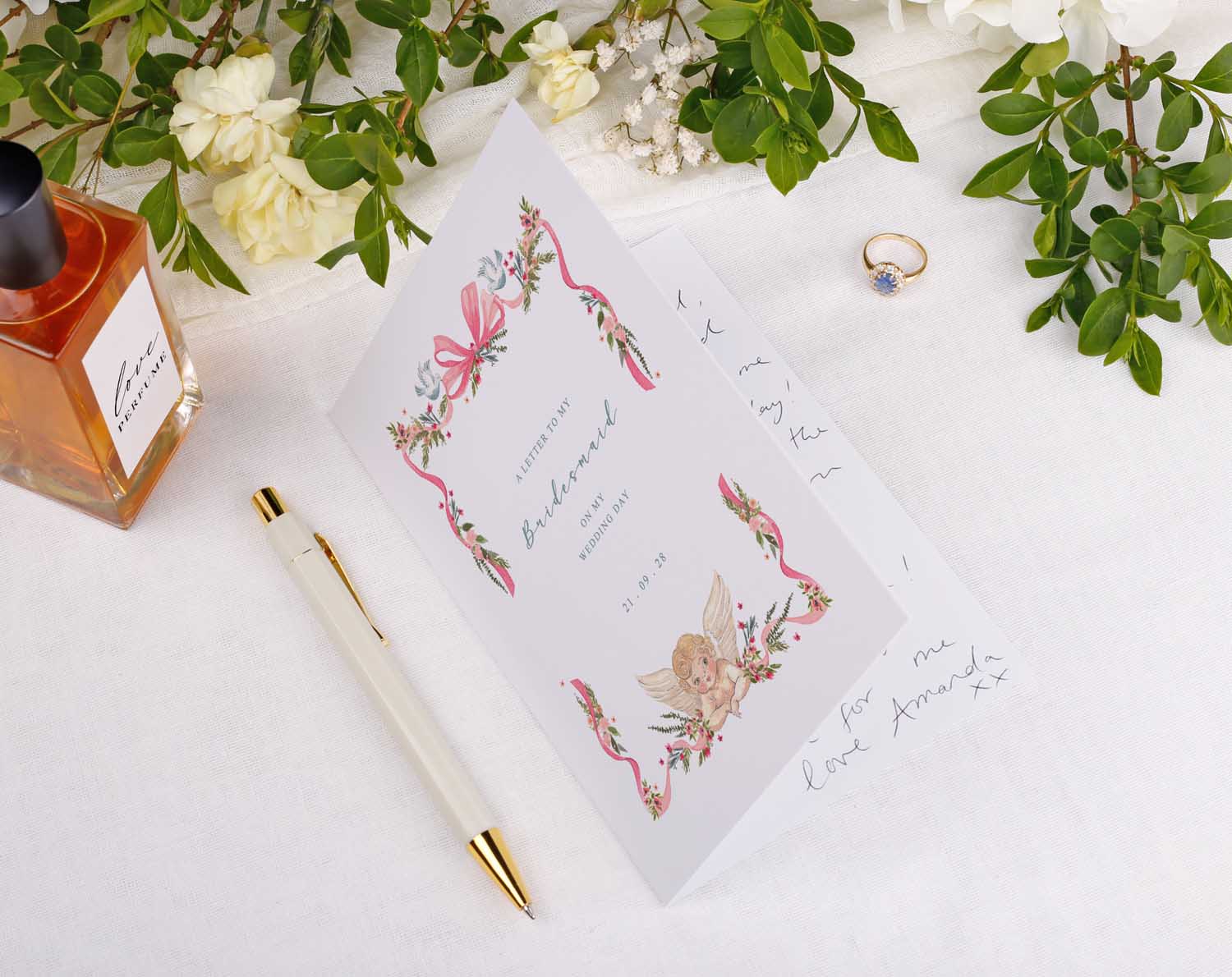 Vintage Wedding Thank You Card displayed with floral decorations, a pen, and a ring on a soft fabric background.