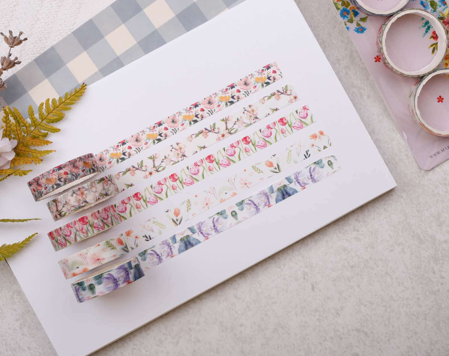 Watercolour Floral Washi - Variety pack of floral washi tape rolls displayed on a crafting background.