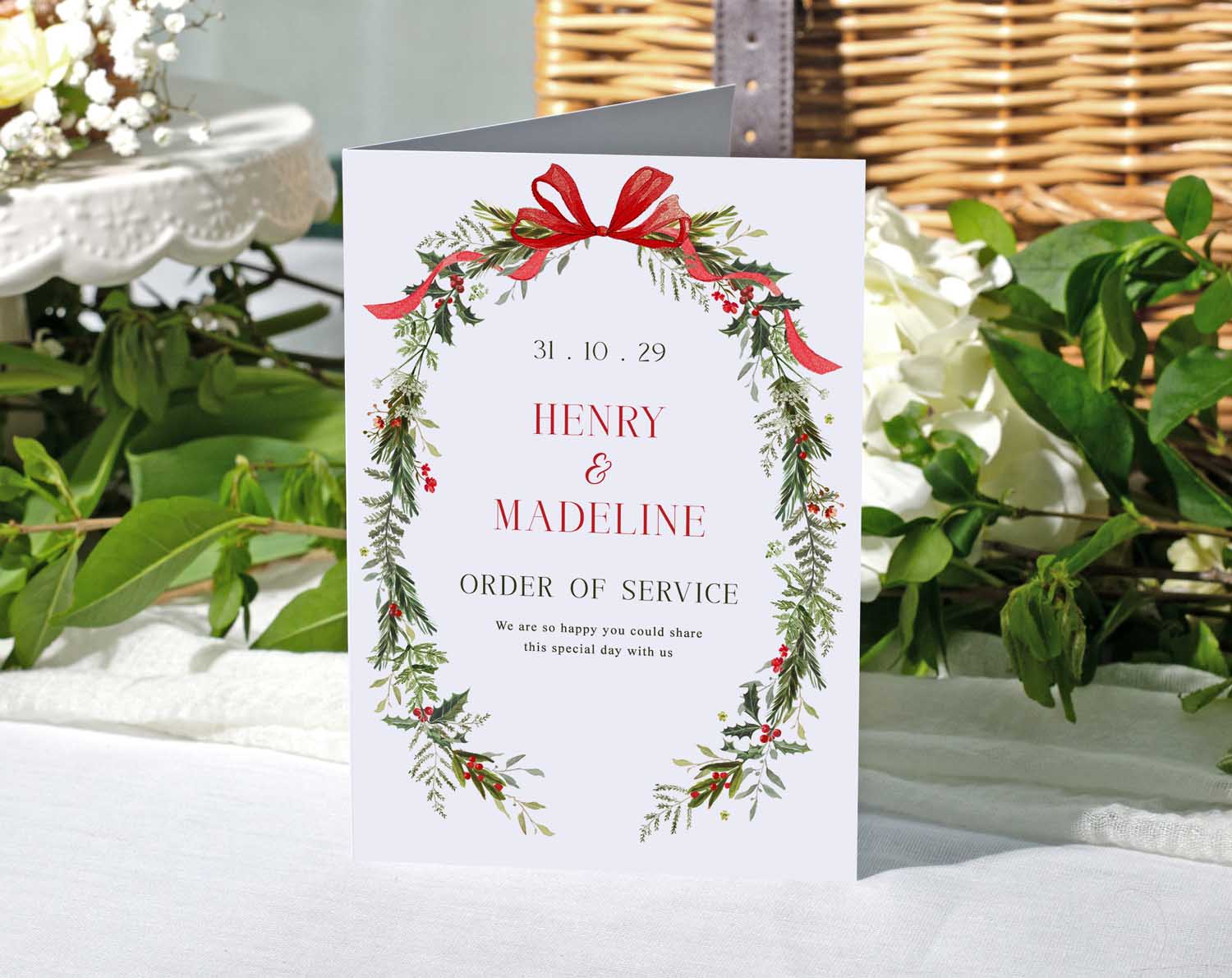 Winter Order Of Service booklet featuring seasonal foliage and red bow detail for a festive wedding ceremony.