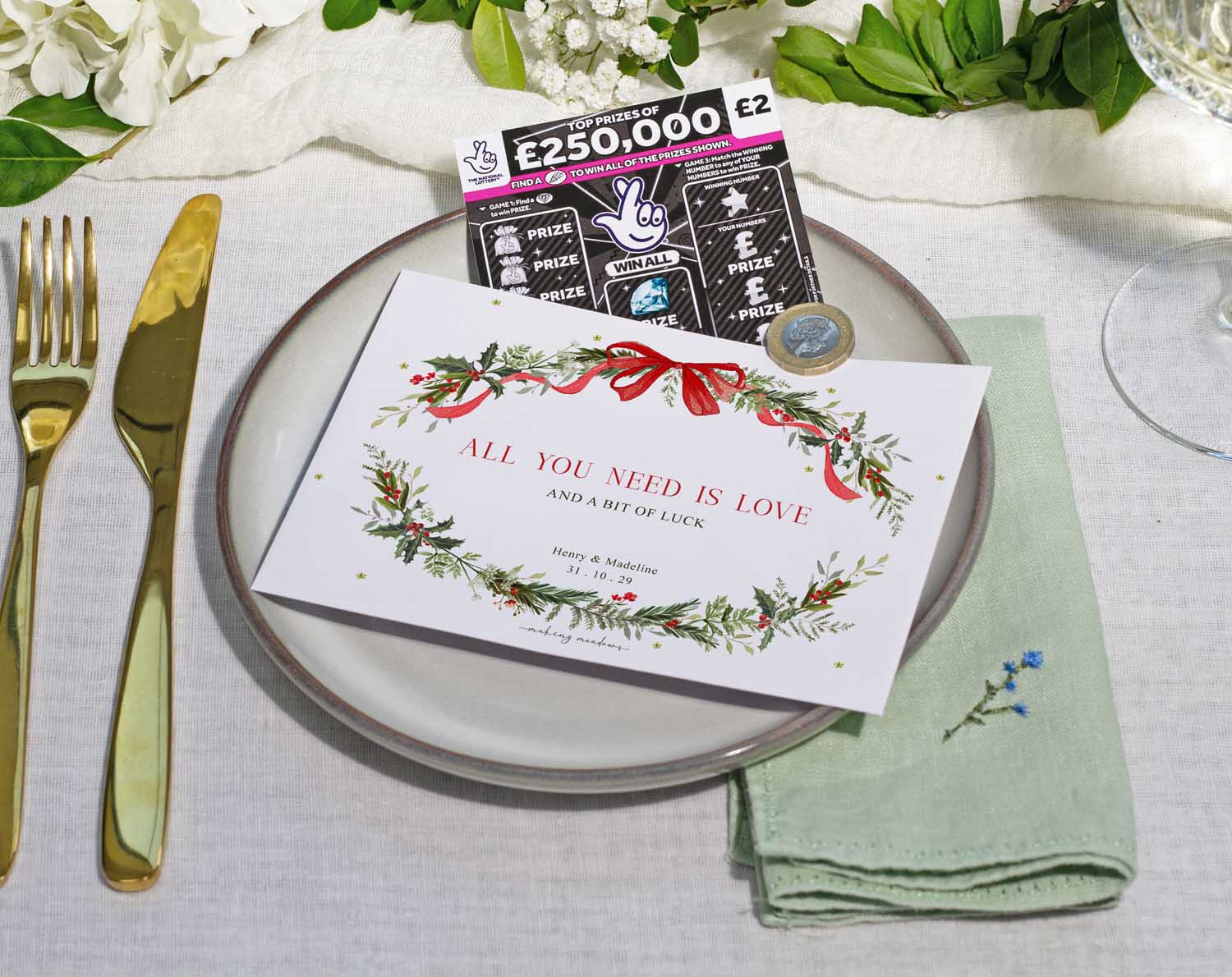 Winter Scratch Card Envelopes for wedding favours on a dinner plate with floral decoration and a scratch card.